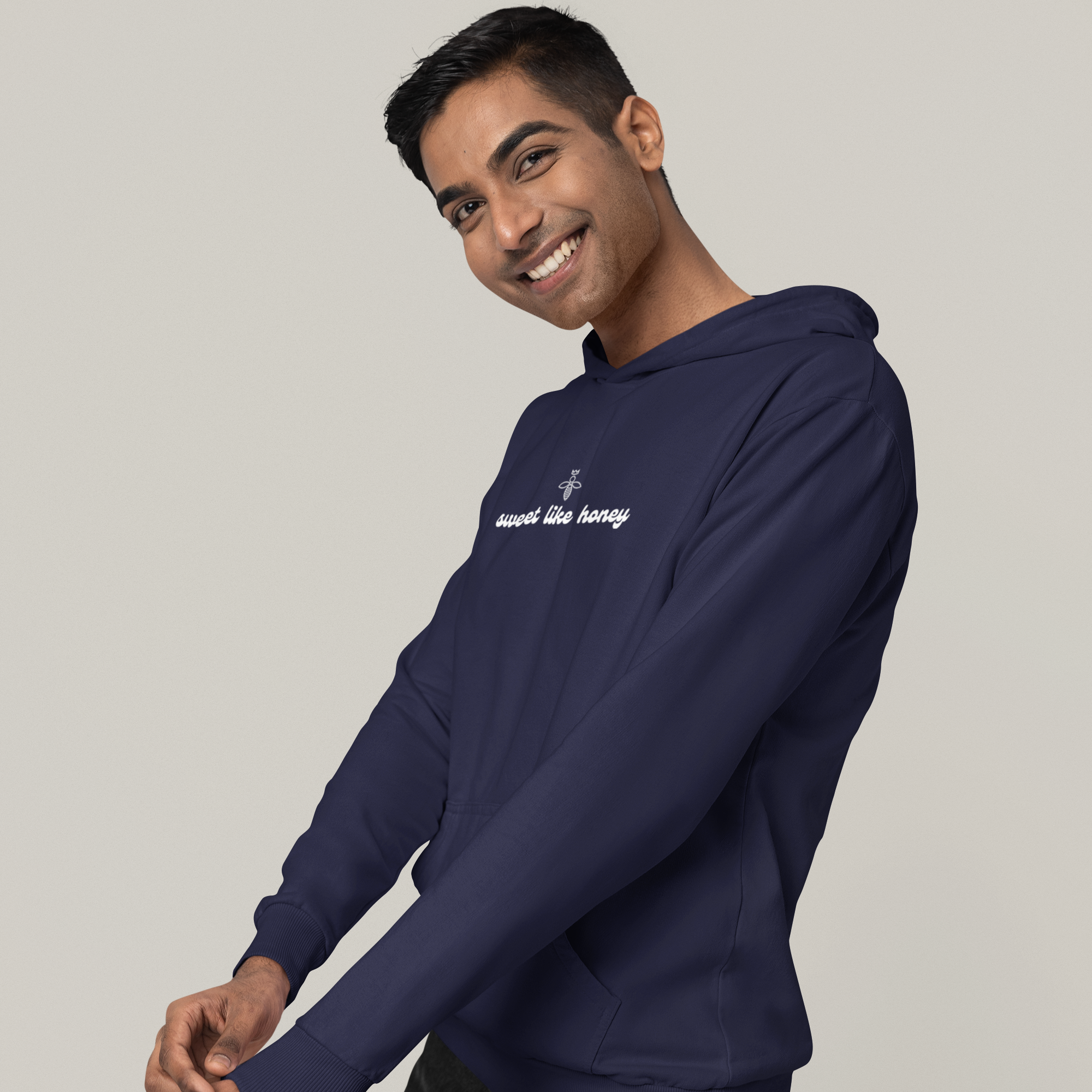 gildan-hoodie-mockup-featuring-a-happy-man-posing-in-a-studio-with-a-customizable-background-m37551.png