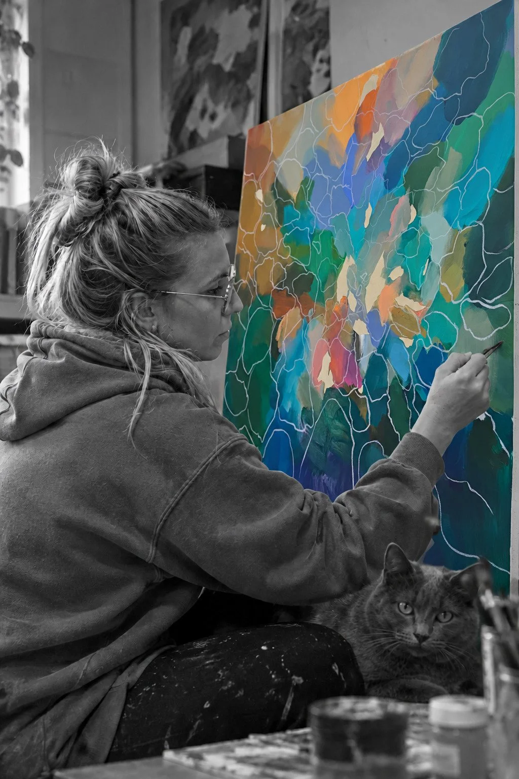 Canadian contemporary artist Annabelle Sirois (NABZ) painting a colorful abstract artwork from her Through collection in her studio.