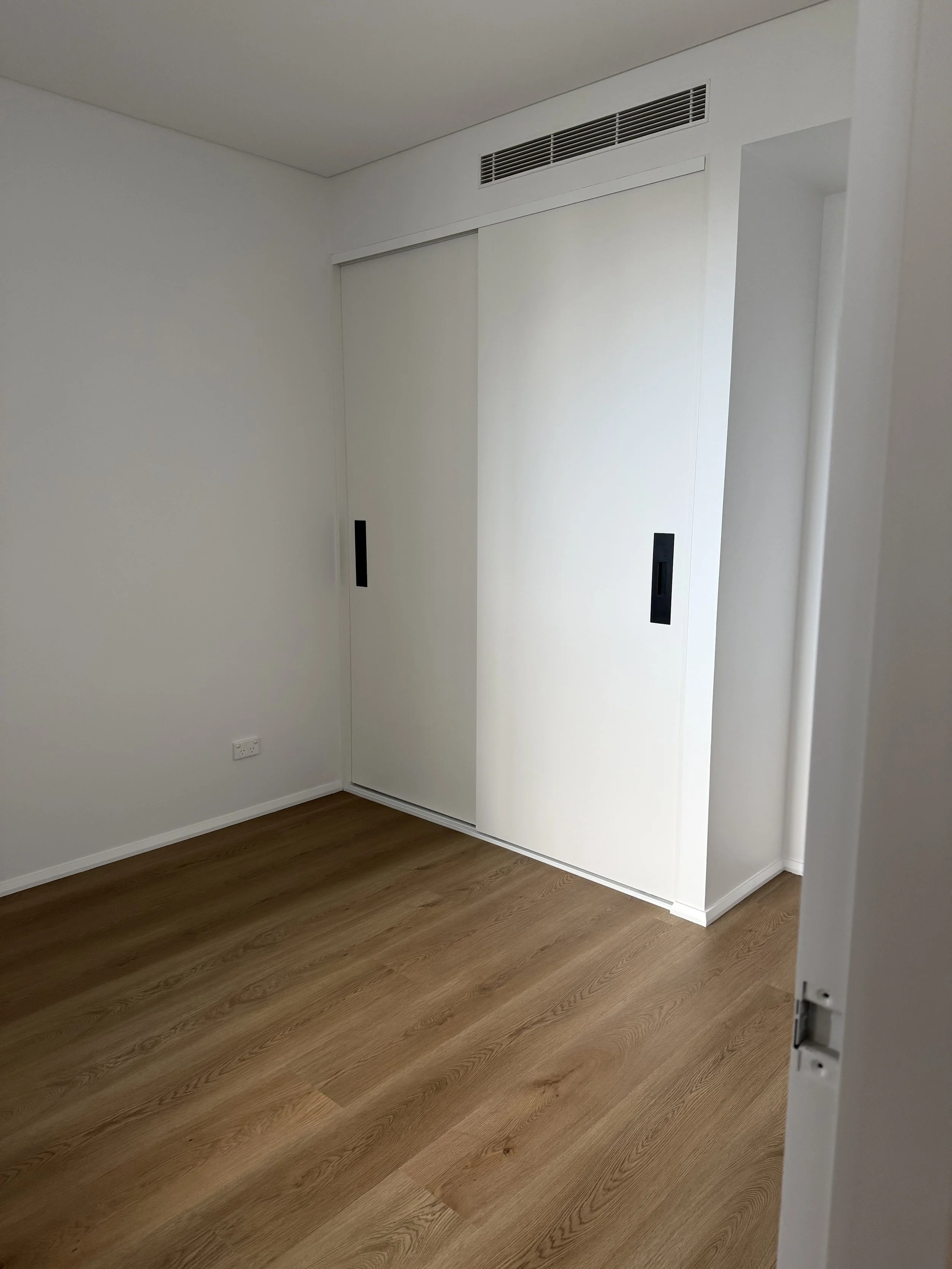 Construction cleaning in progress on a completed residential build