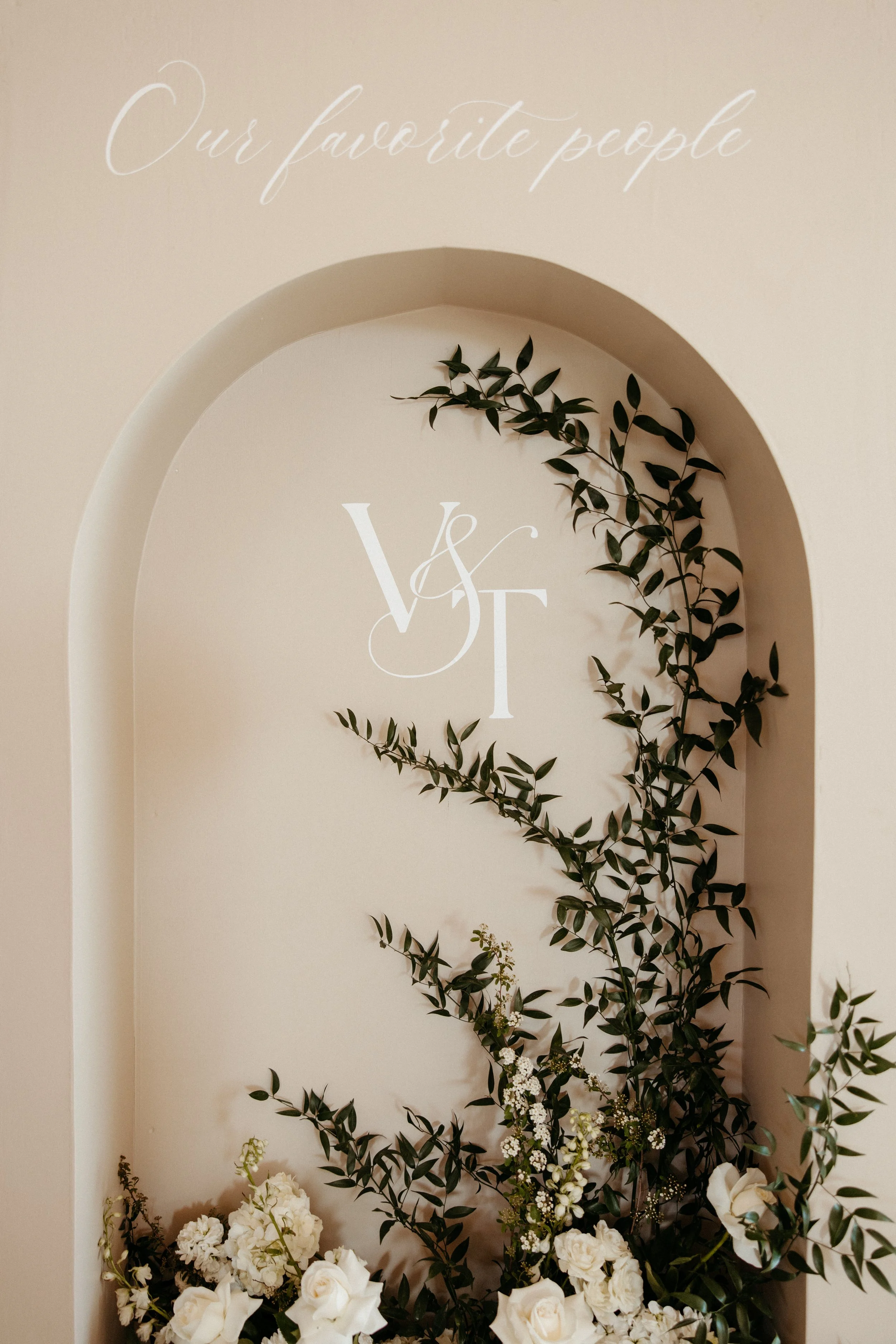 Wedding welcome sign for Stephanie and Connor on August 10, 2024, surrounded by white flowers.