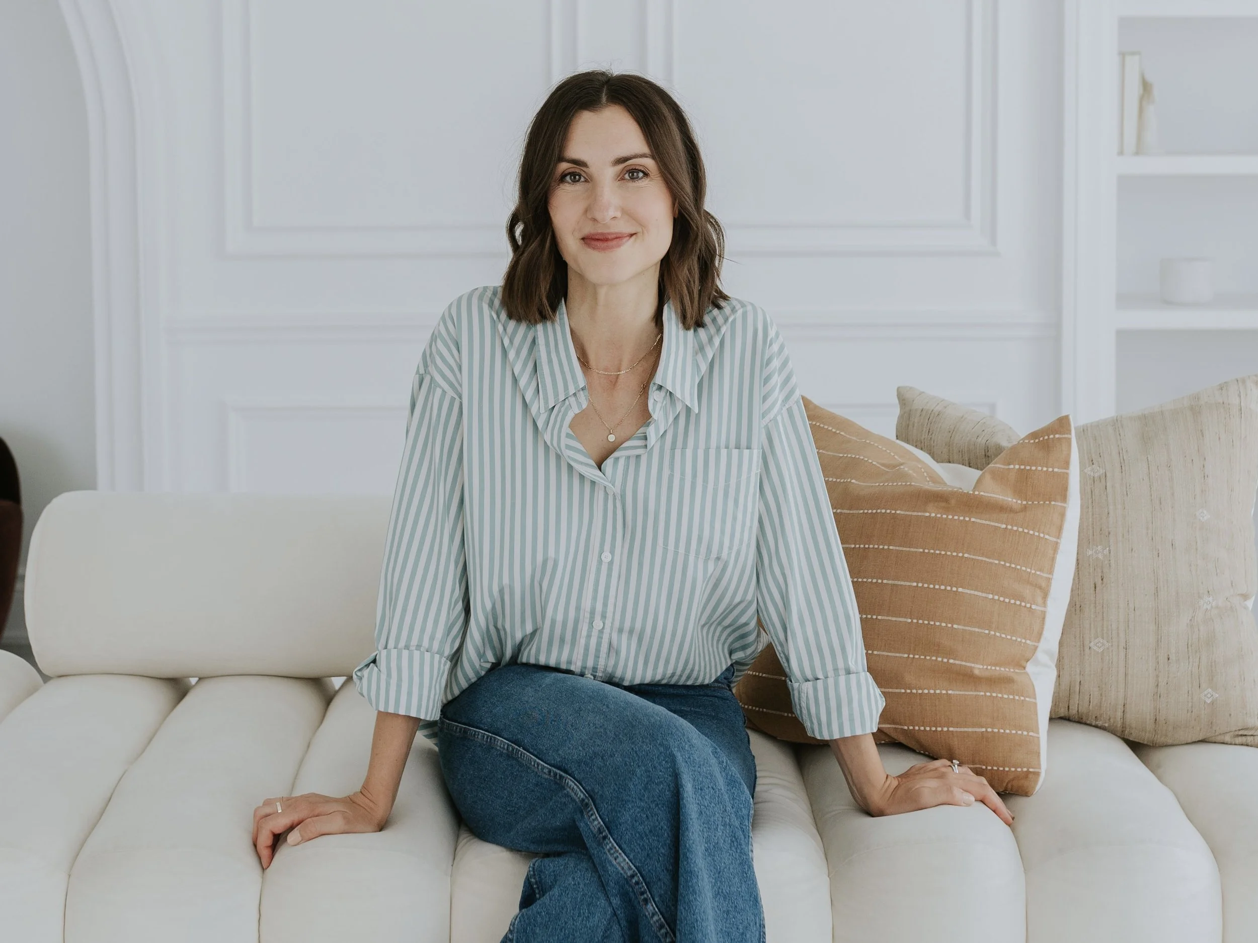Laura Maksymetz, Registered Psychotherapist, in a bright therapy office in Burlington, Ontario.