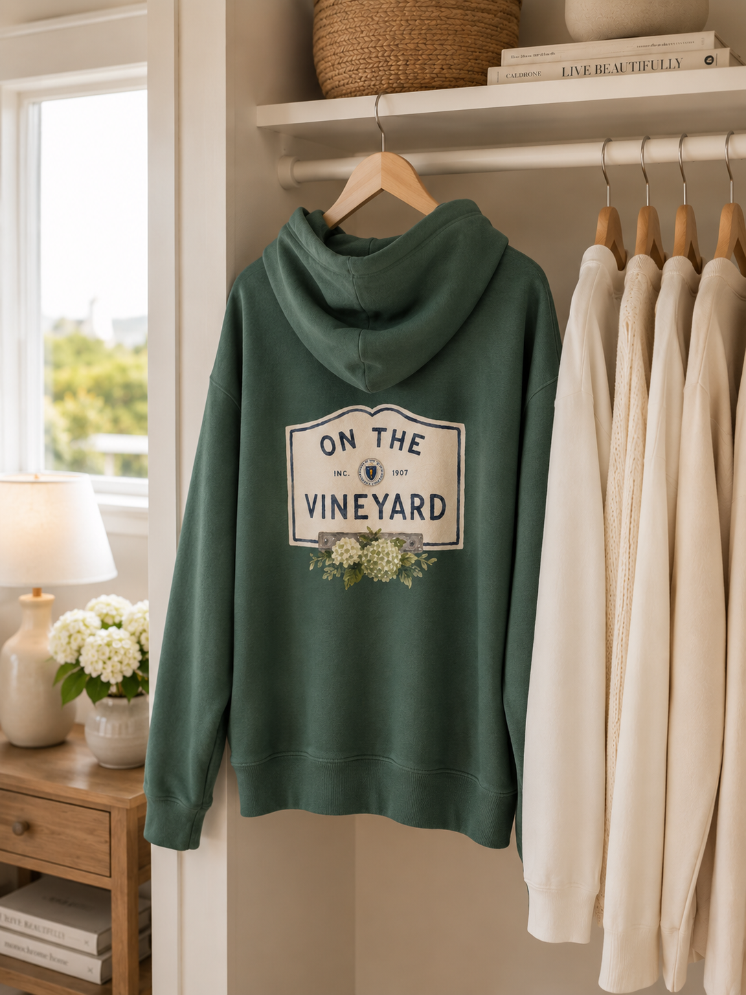 On the vineyard hoodie green closet hanging mockup1.png