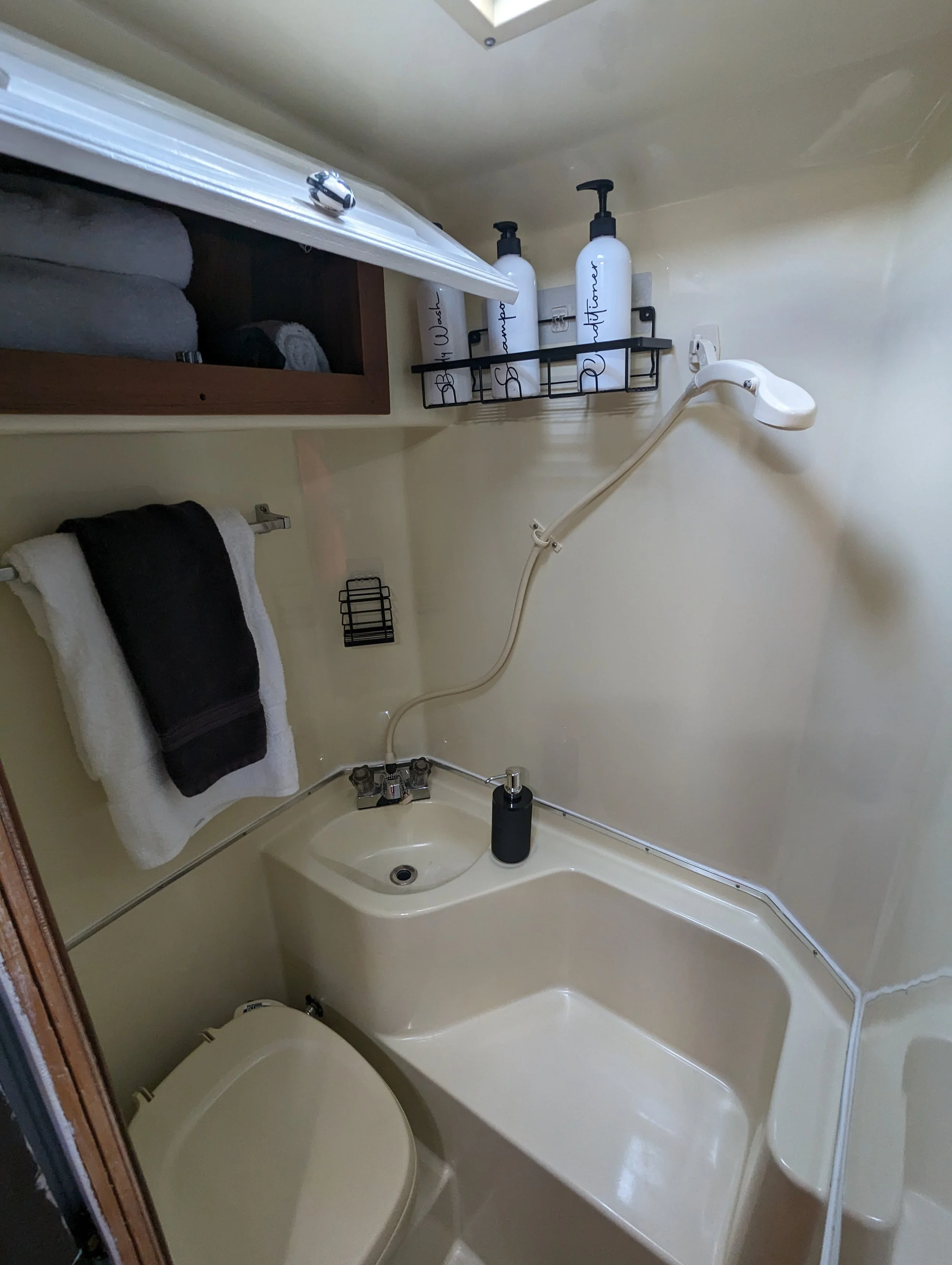 Bathroom with shower, sink and toilet