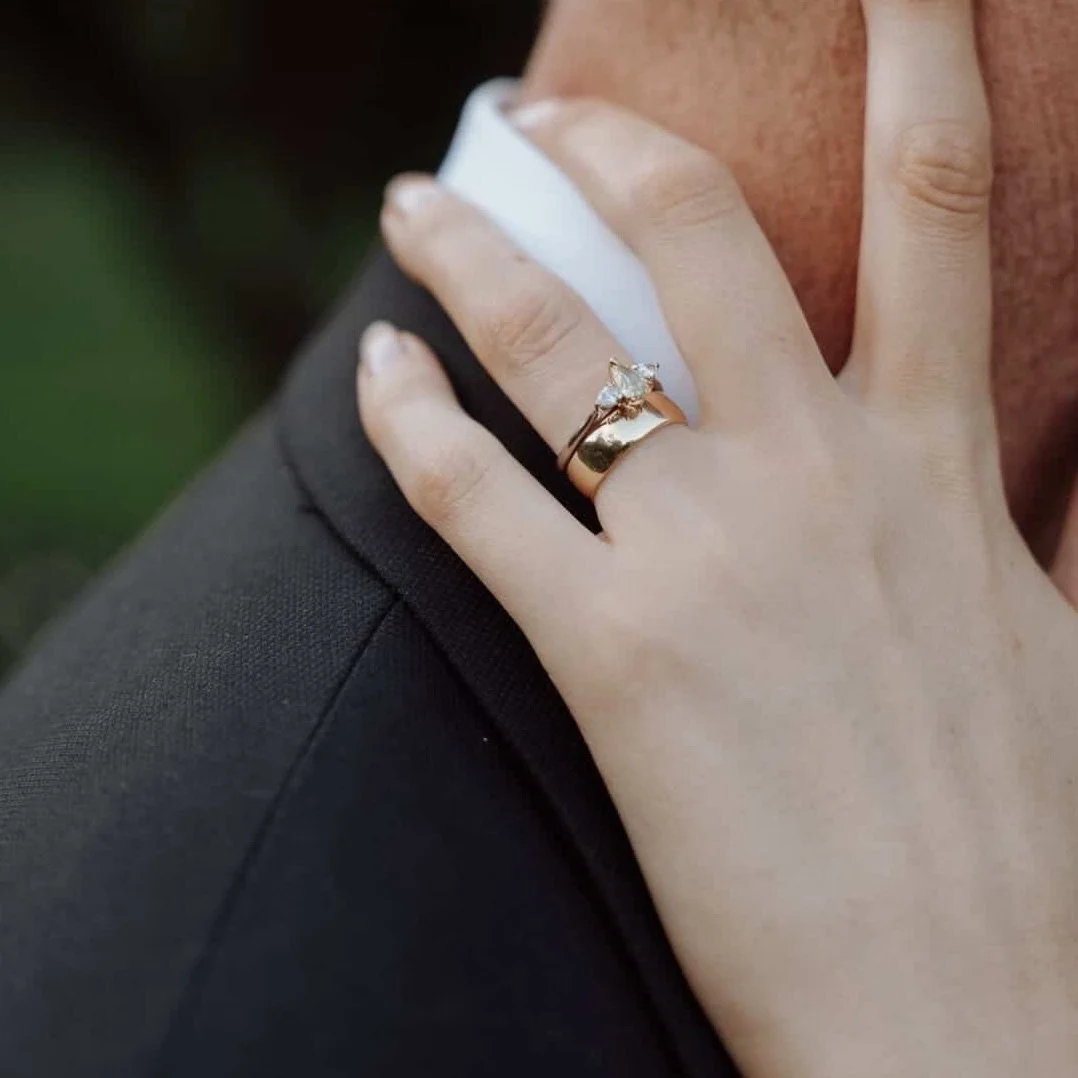 Melina Jewellery captured on the special day of Ellie &amp; Myles.

Image captured by @doxa.visual 

#bespokeweddingrings #custommadejewellery #engagementring #weddingring #triologyring