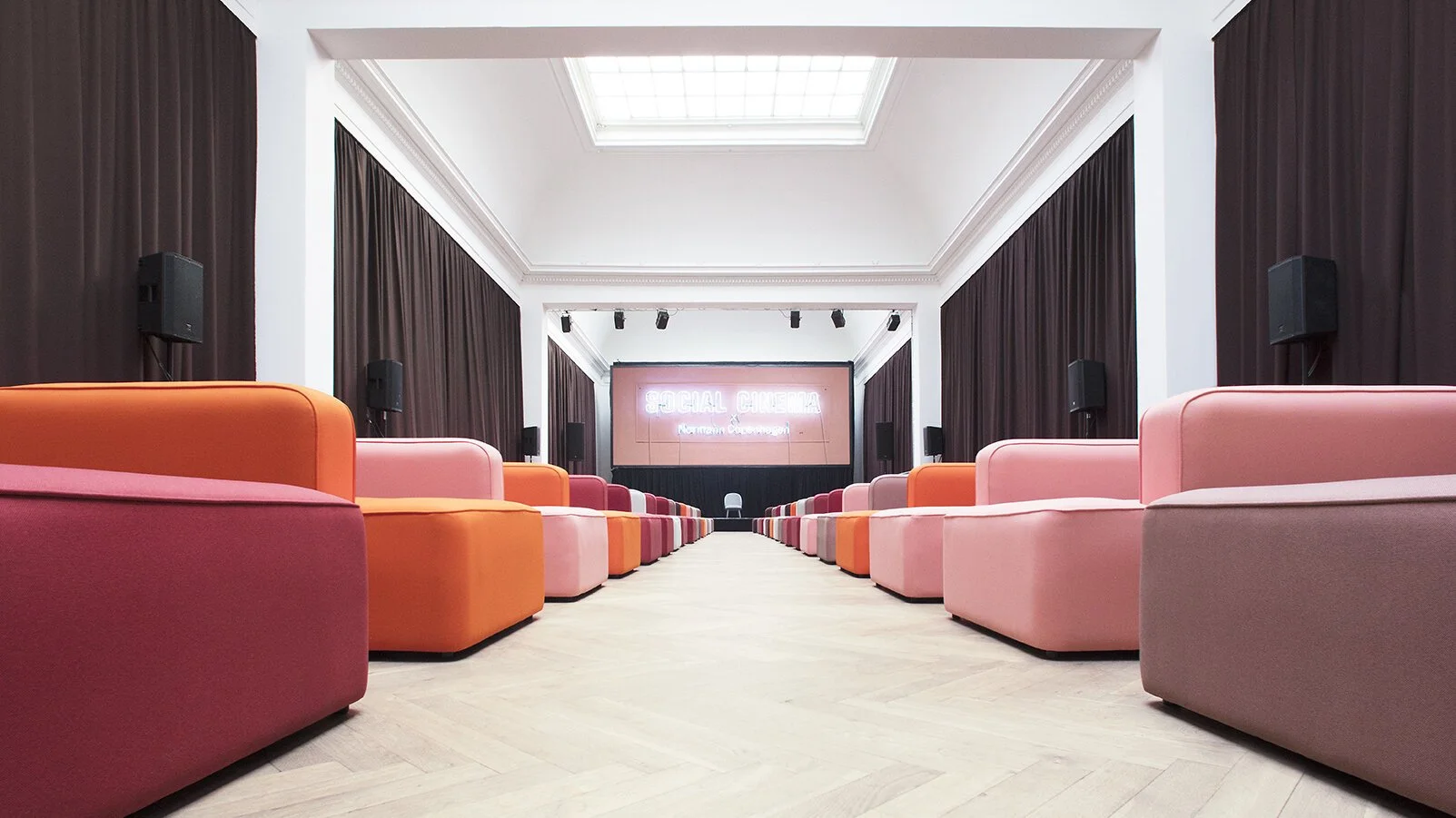 Conference room with pink and orange armchairs