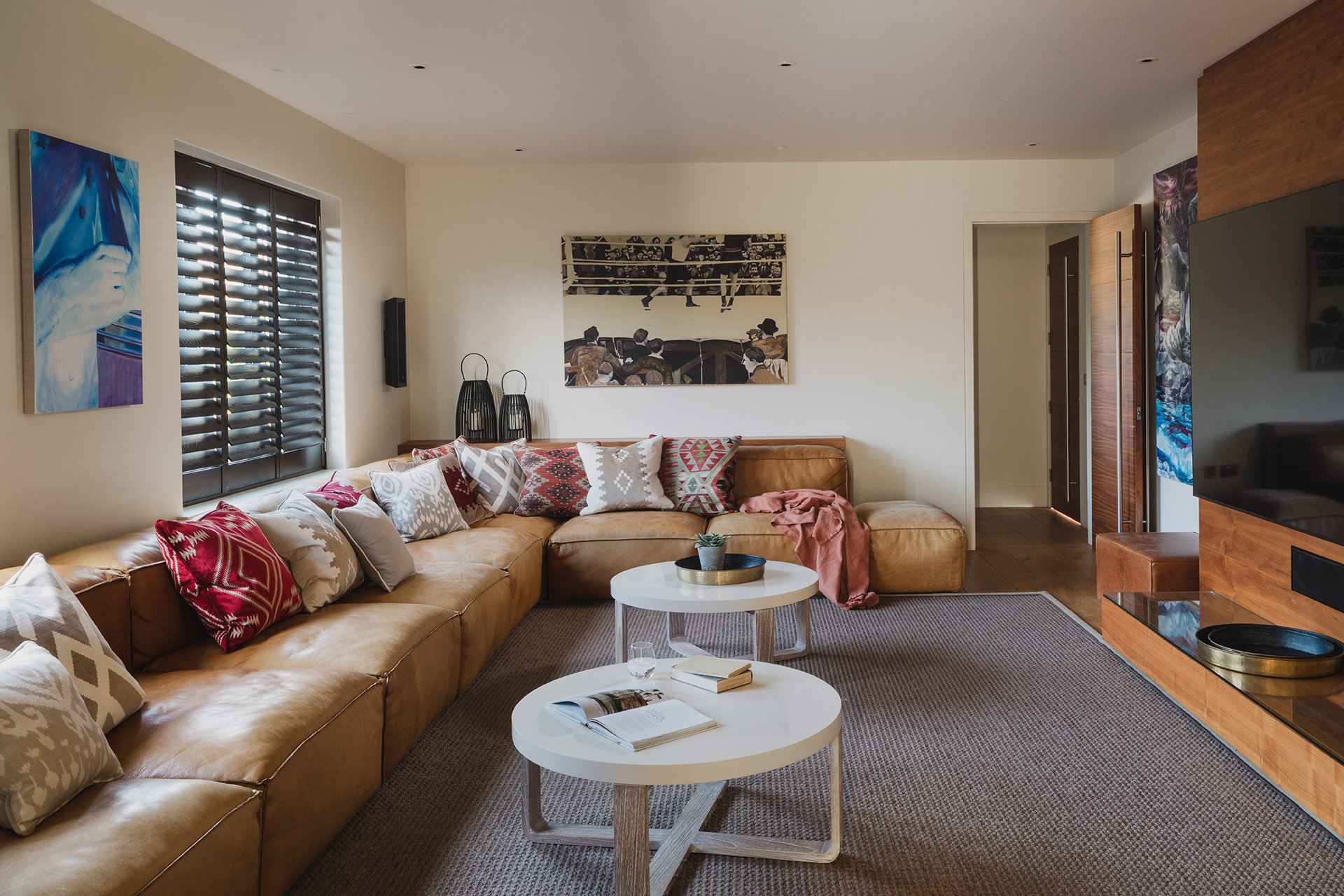 Little Polgarron's cinema room features a 98-inch smart television and a huge leather sofa, Fat Boy beanbags and comfy cushions.