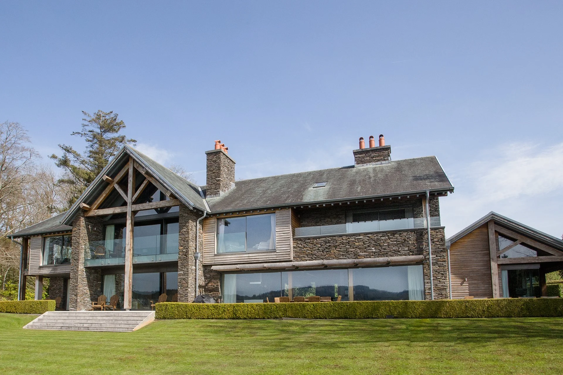 Sitting on the shore of Lake Windermere, Grey Gables is an impressive and luxurious Lakeland-stone home with incredible views and a range of special extras, including lumipod design-led gym and sauna with Lake views, a home cinema and games room.