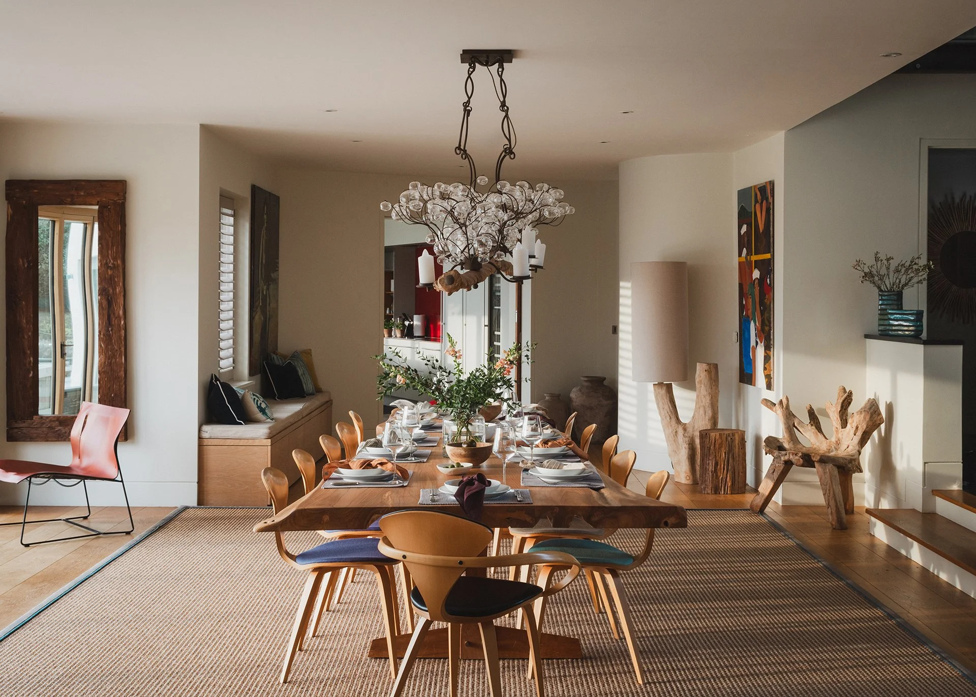 The adjacent dining features a bespoke dining table from New York with Cherner. Doors lead out to the garden terrace and garden - perfect for an evening BBQ.
