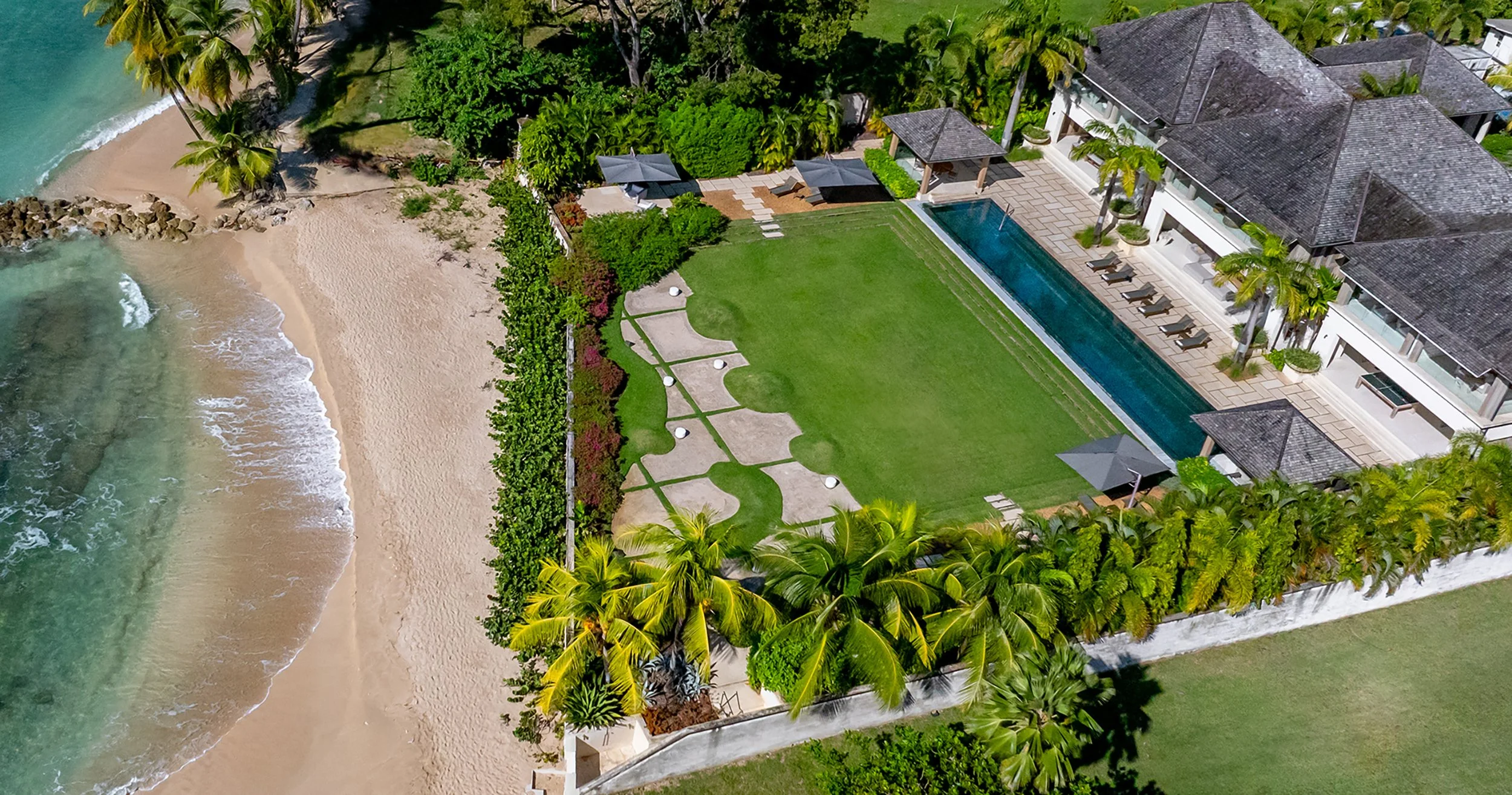 Godings Beach House is located on Barbados’ sought-after west coast, near Speightstown. In over 1.2 acres of private gardens, this stunning beachfront house boasts a 25m infinity pool, the latest water sports kit and a home gym.