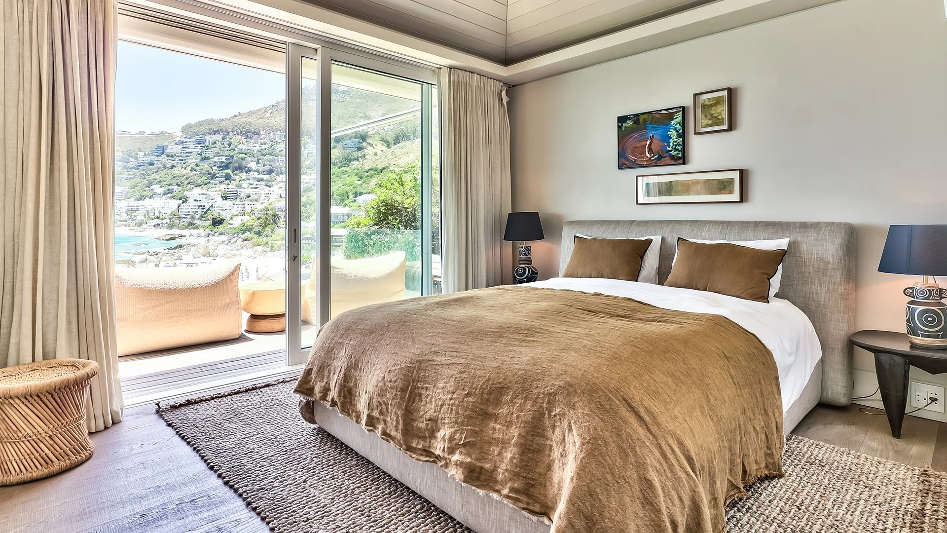 Each of the three bedrooms has an en suite bathroom, king-size bed and access to outside decked areas through floor-to-ceiling windows. The master bedroom has a spacious bathroom with two sinks, shower and contemporary freestanding oval bath. 
