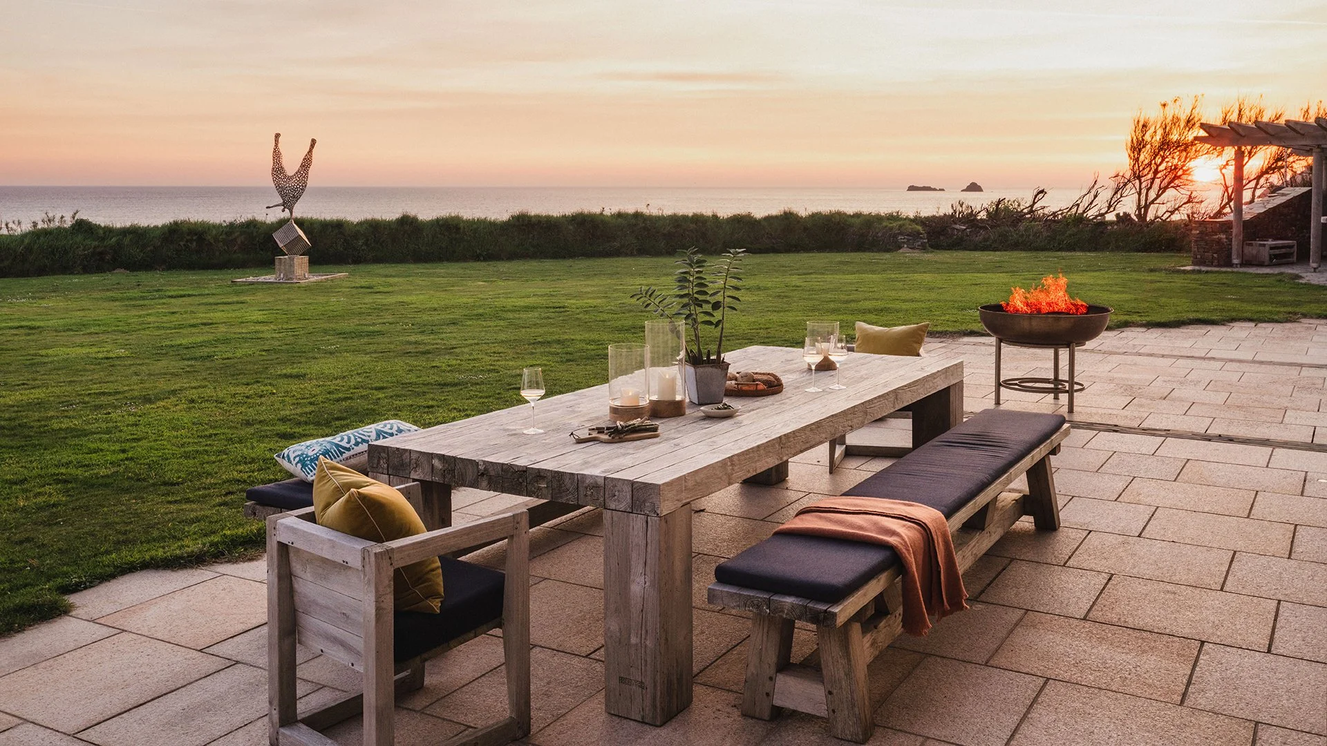 Outside, an acre of garden includes a terrace with sun loungers and a BBQ area. A gate gives direct access to the South West Coastal Path and the beach.