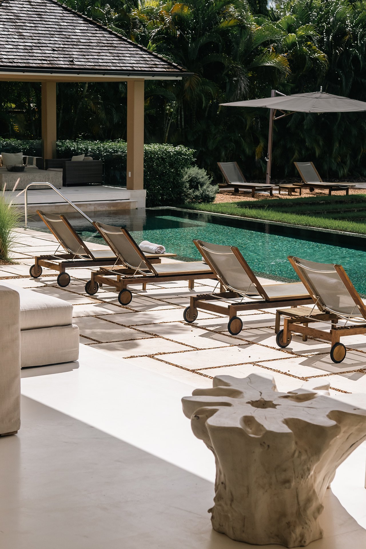 The clever design brings the outside in with incredible views of the infinity pool and the sea beyond from the villa’s spacious, open plan living area.