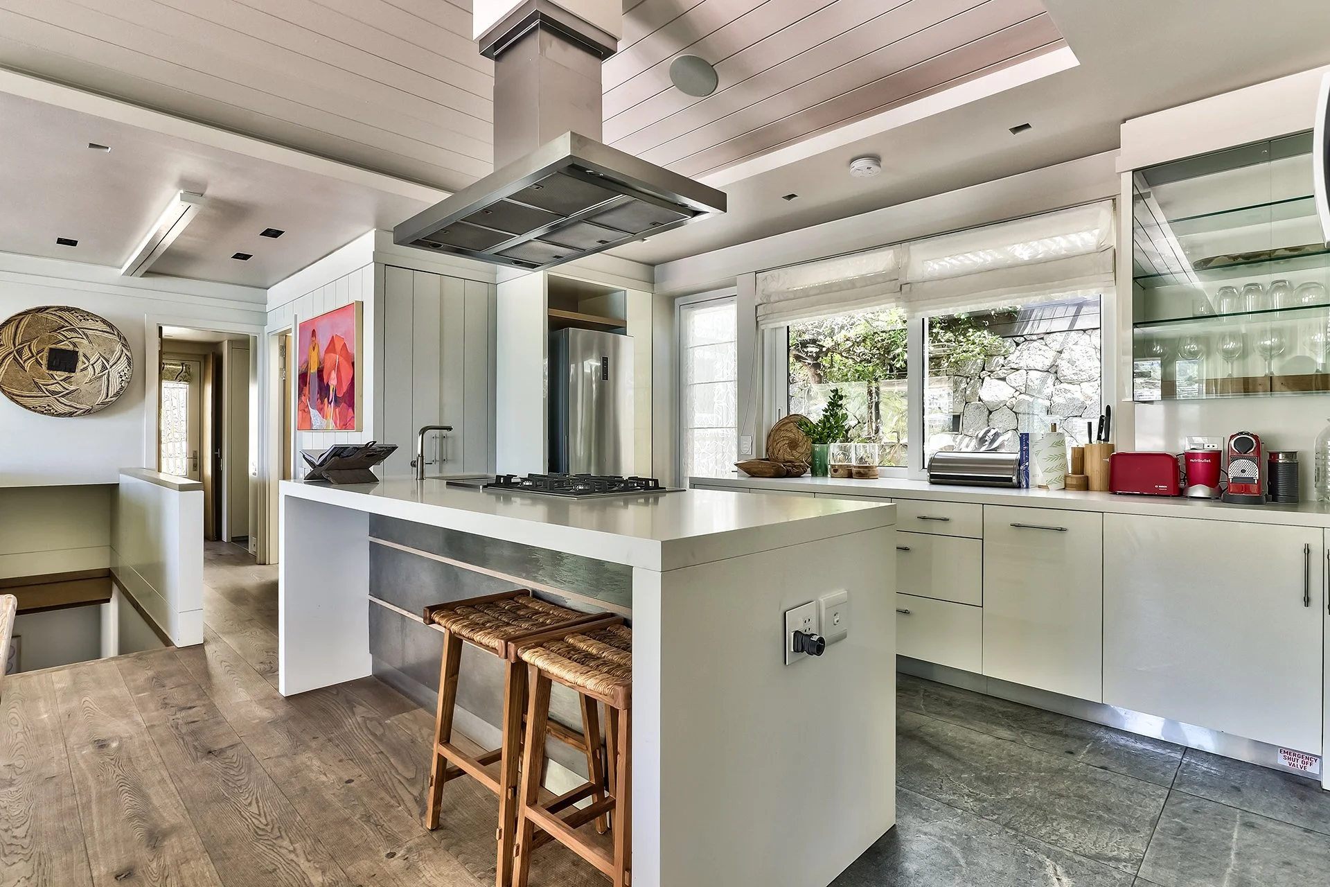 The kitchen is fully-equipped with island and cooker/worktop offering ocean views.