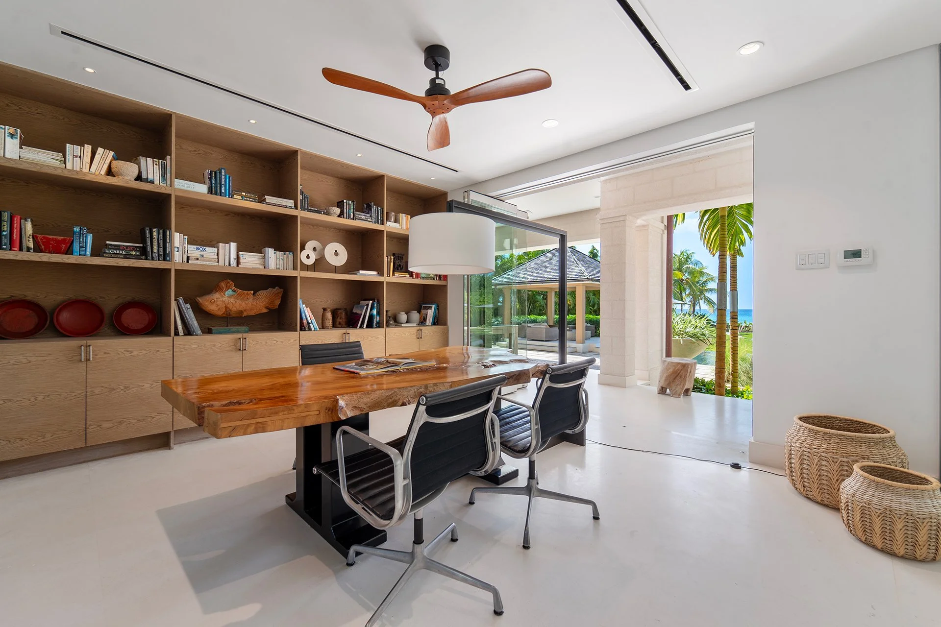 A glass-walled study in SimonEscapes Godings Beach House.