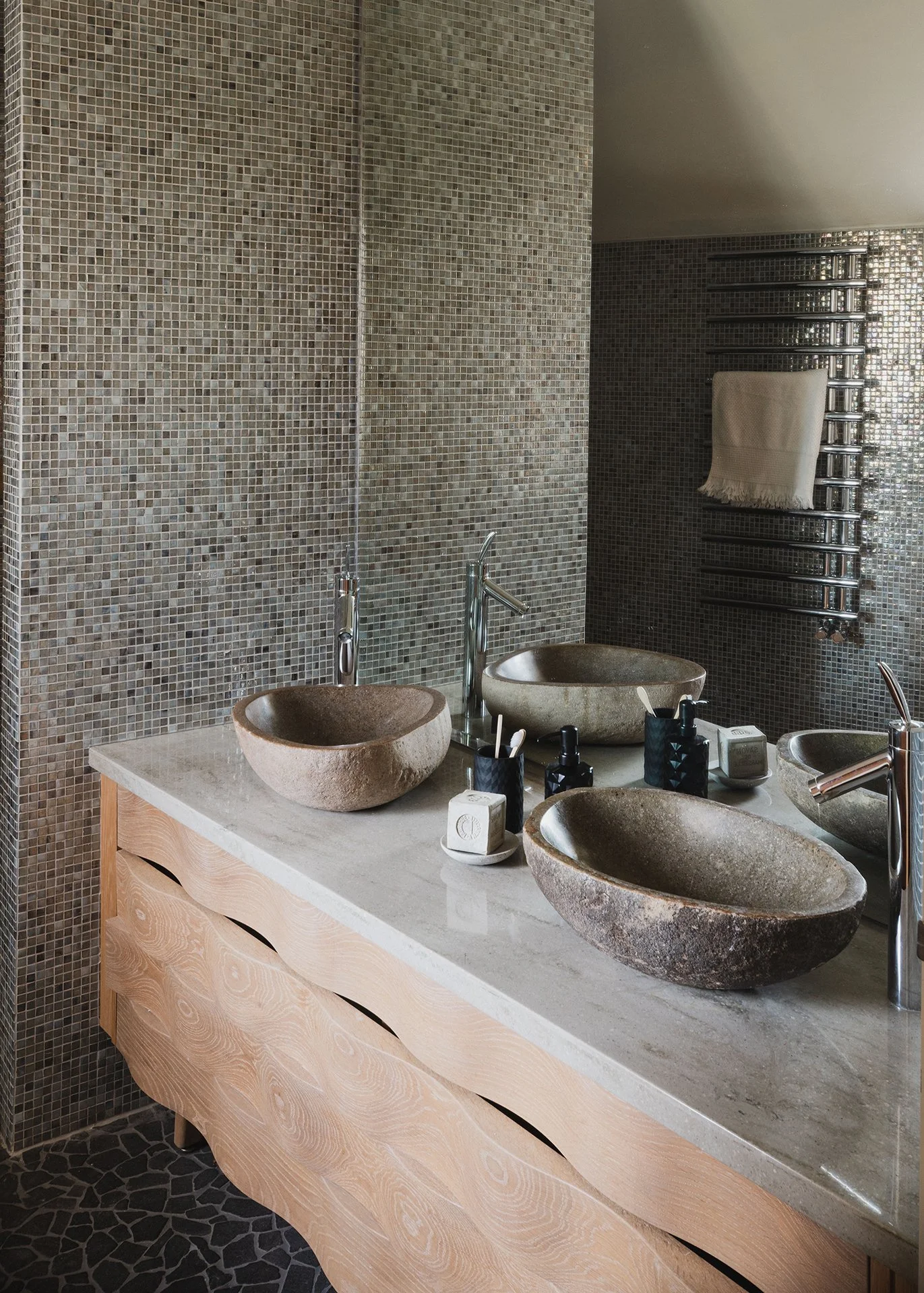 En suites have Hansgrohe deluge showers and Fired Earth and Island Stone tiles; three bedrooms have a freestanding Castello bath.