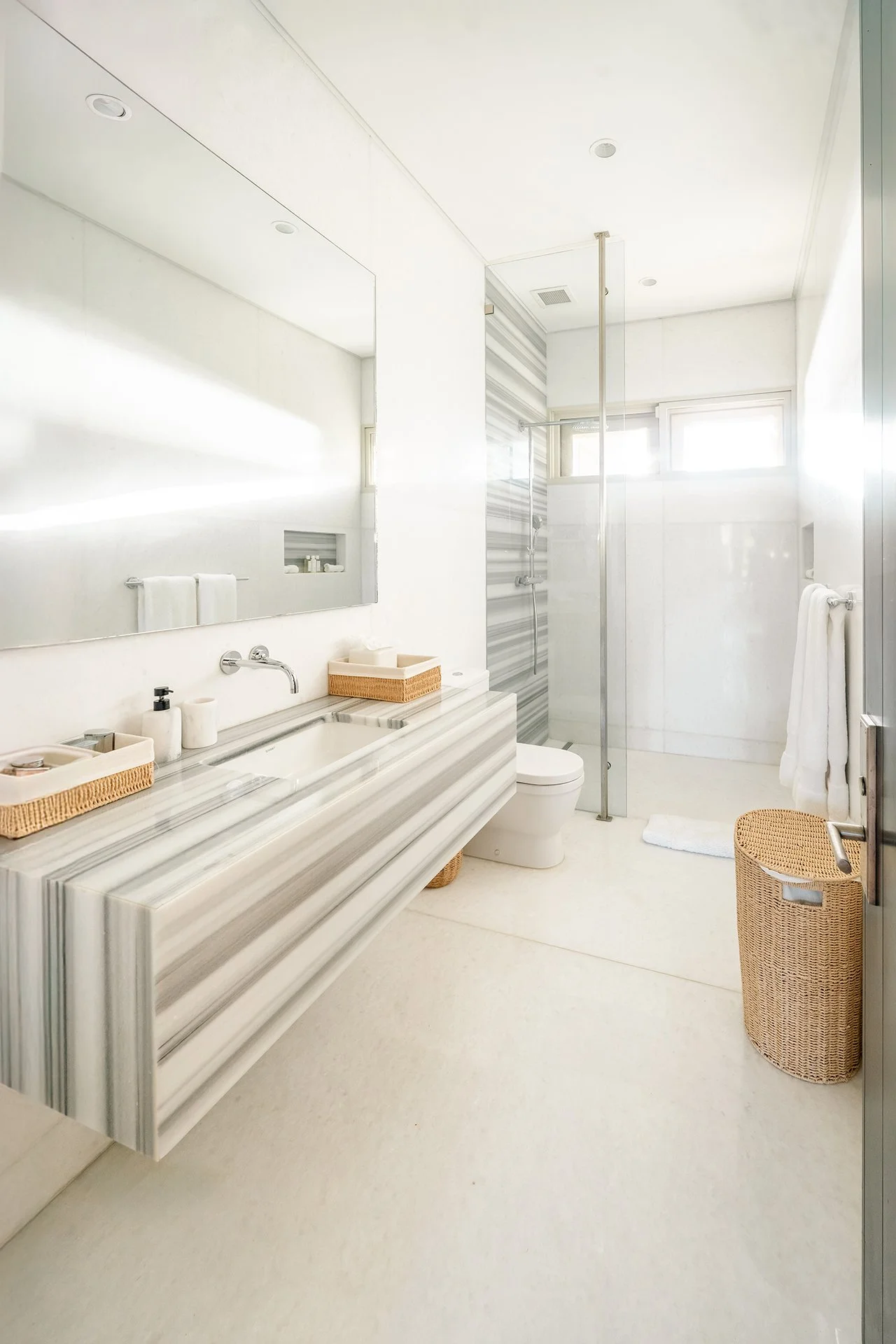 Each bedroom has a walk-in dressing room, private terrace and luxury bathroom furnished with Hansgrohe rain shower, mosaic tiles from Ann Sacks and marble vanities.
