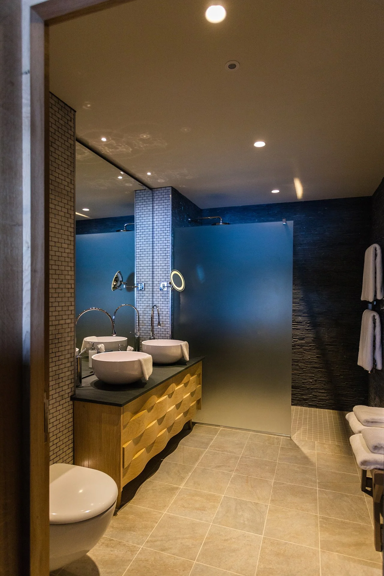 Two bedrooms have oval baths overlooking Lake Windermere. All bathrooms have Mandarin Stone walls and giant Drench showers.