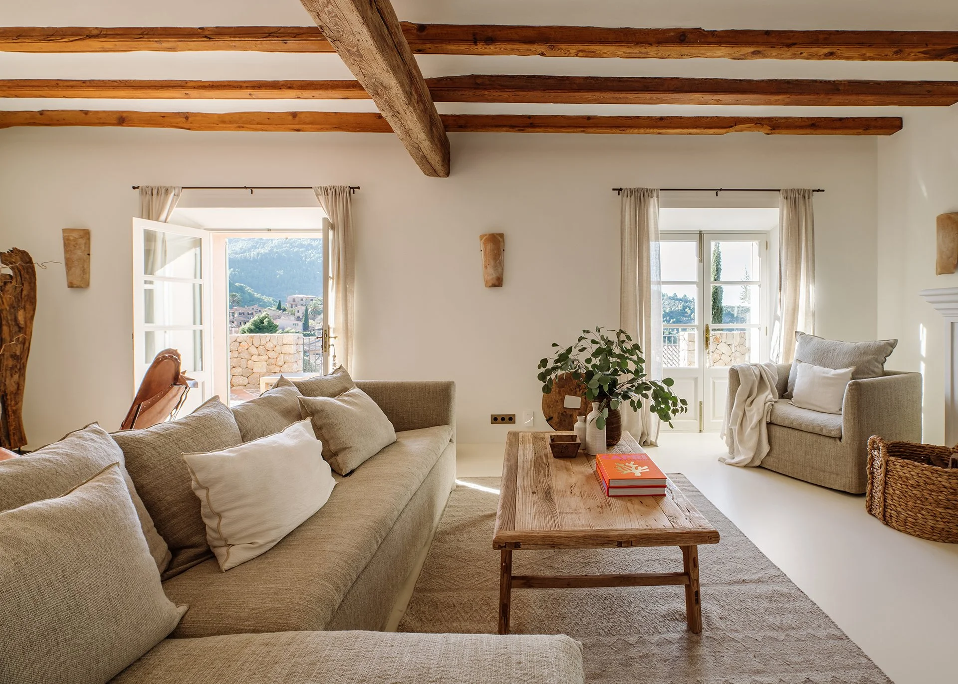 Subtle neutral tones and designer pieces by Roche Bobois, Ralph Lauren, Decorus, Cherner Chair Company and Maxalto. Relaxed, comfy seating and magnificent vaulted beamed ceiling. Stelle chandelier by Barcelona Design casting an impressive glow over t