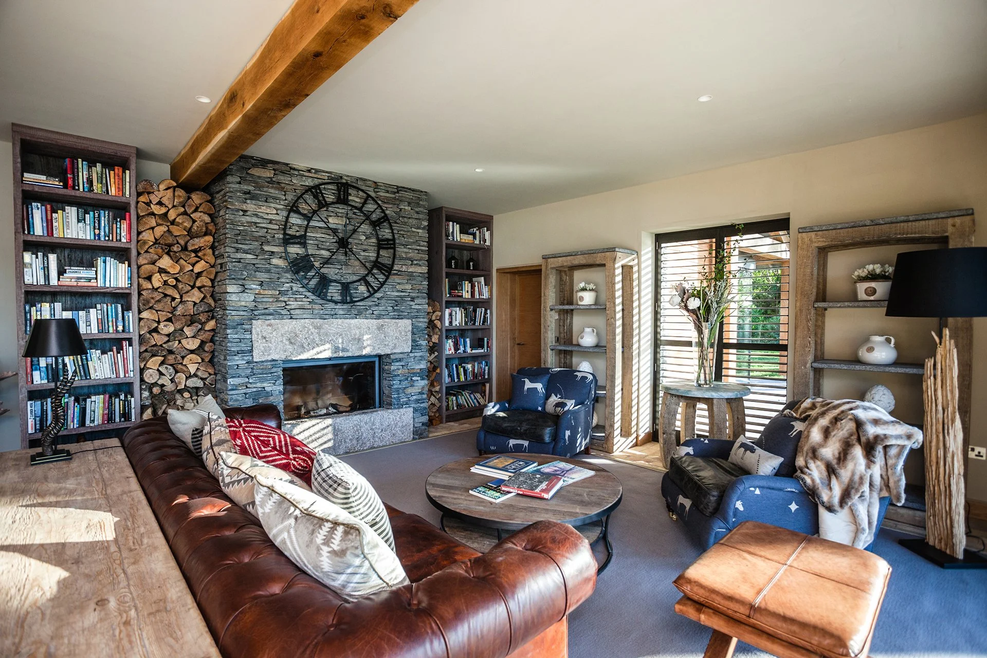 The spacious, open-plan living area features a high-spec kitchen, impressive dining table and living area with Stuv woodburner faced with local Burlington Stone. The main lounge with woodburner and additional snug are ideal for late-night get-togethe