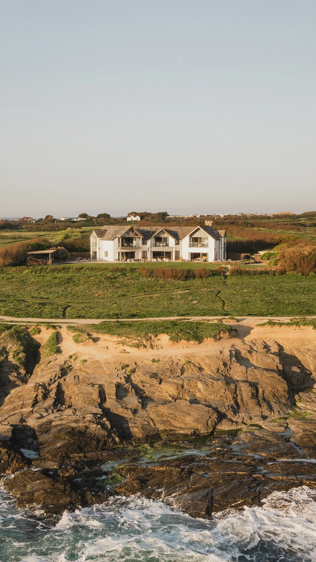 Swathed in glass and timbered gables, Little Polgarron is the ultimate Cornish beach house accommodating up to 10 guests and located next to the prestigious Trevose Head golf course and just a few minutes' walk from the beach at Booby's Bay.
