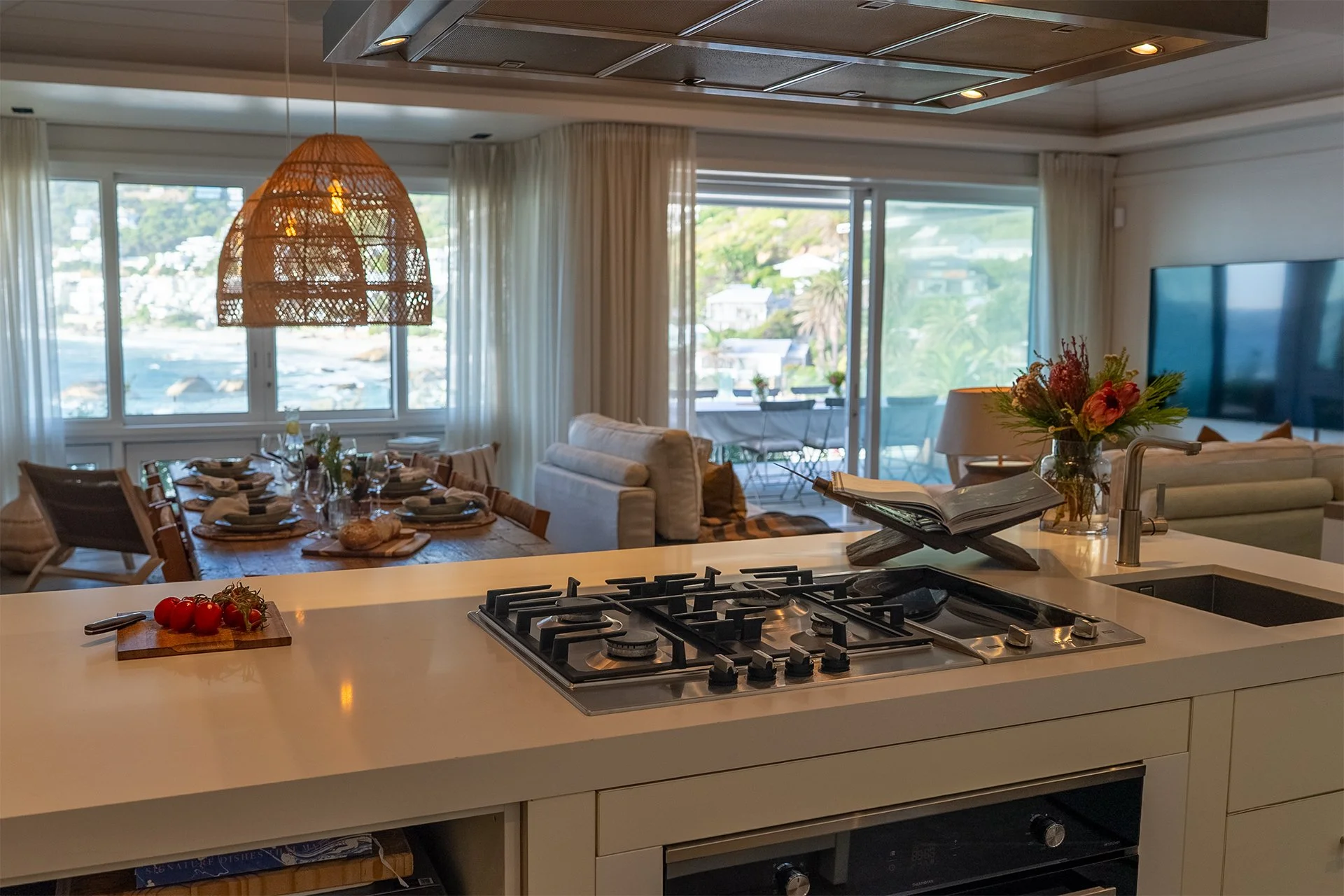 The kitchen is fully-equipped with island and cooker/worktop offering ocean views.