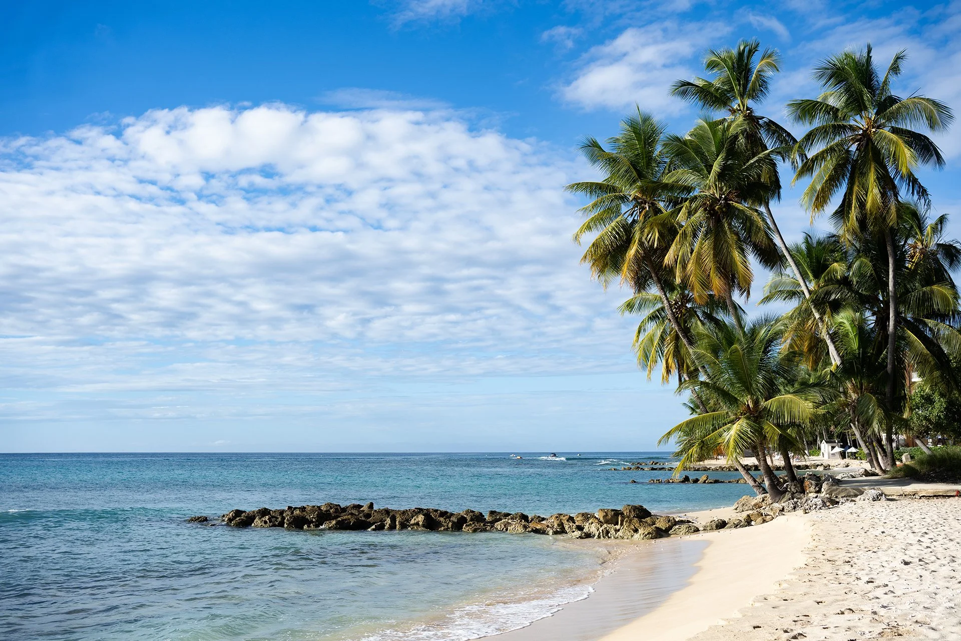 A pebbled path leads directly to a protected beach at Simon Escapes Godings Private Villa.