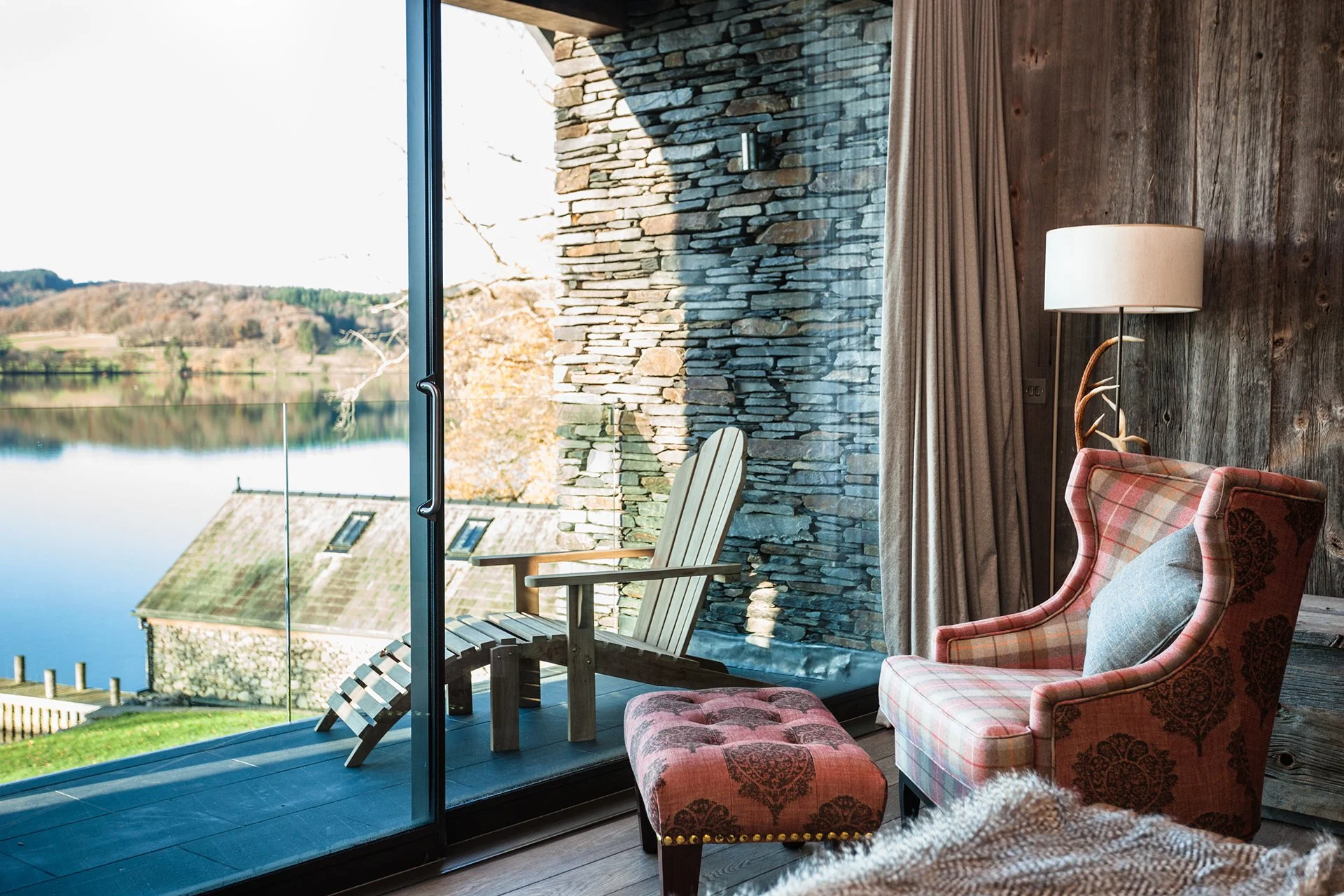 The lake house sleeps up to 10 guests in five bedrooms with interiors features such as decorative antlers, warm plaid fabrics and faux fur rugs contributing to its ski chalet/hunting lodge vibe.