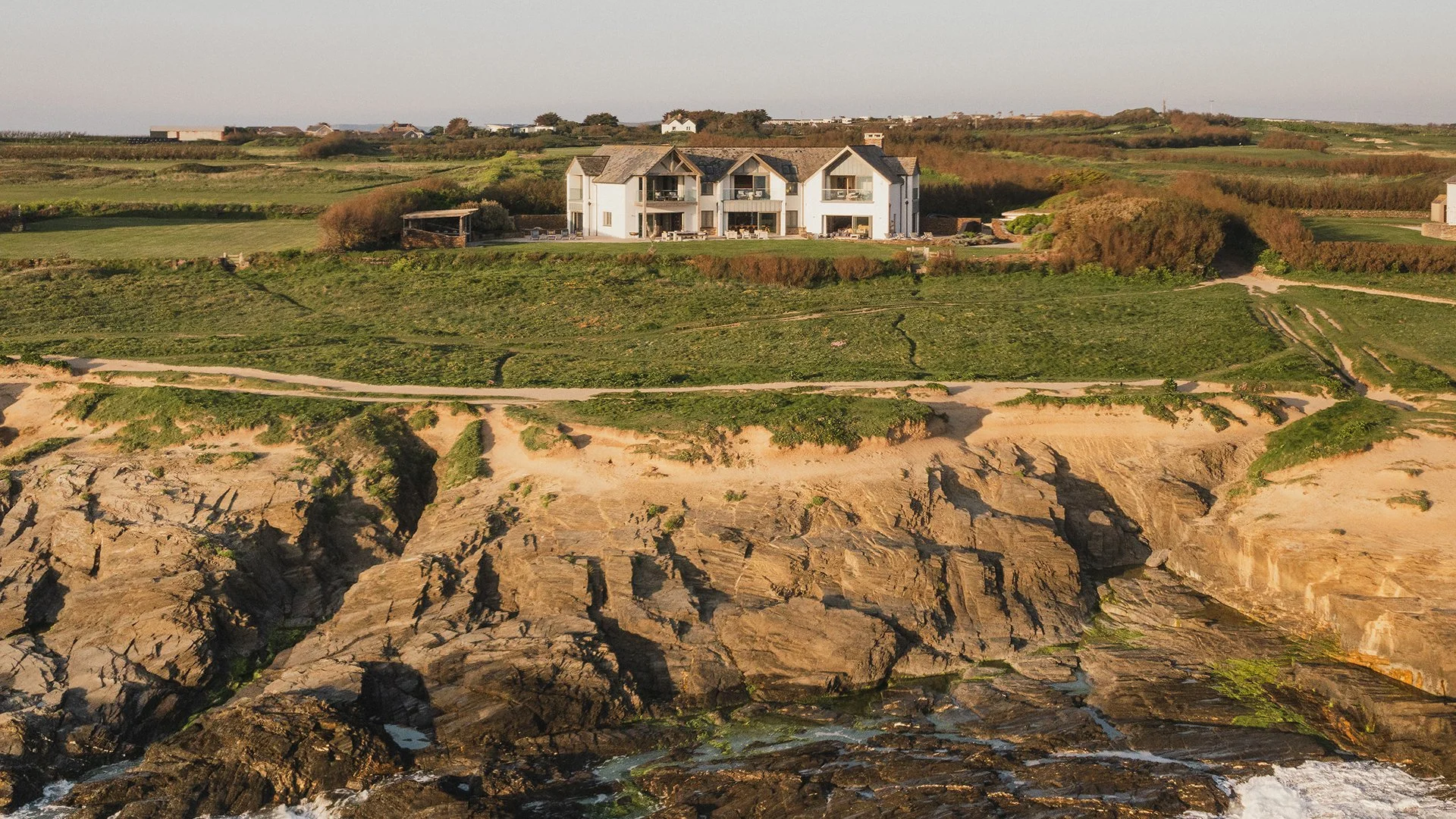 Swathed in glass and timbered gables, Little Polgarron is the ultimate Cornish beach house accommodating up to 10 guests and located next to the prestigious Trevose Head golf course and just a few minutes' walk from the beach at Booby's Bay. 