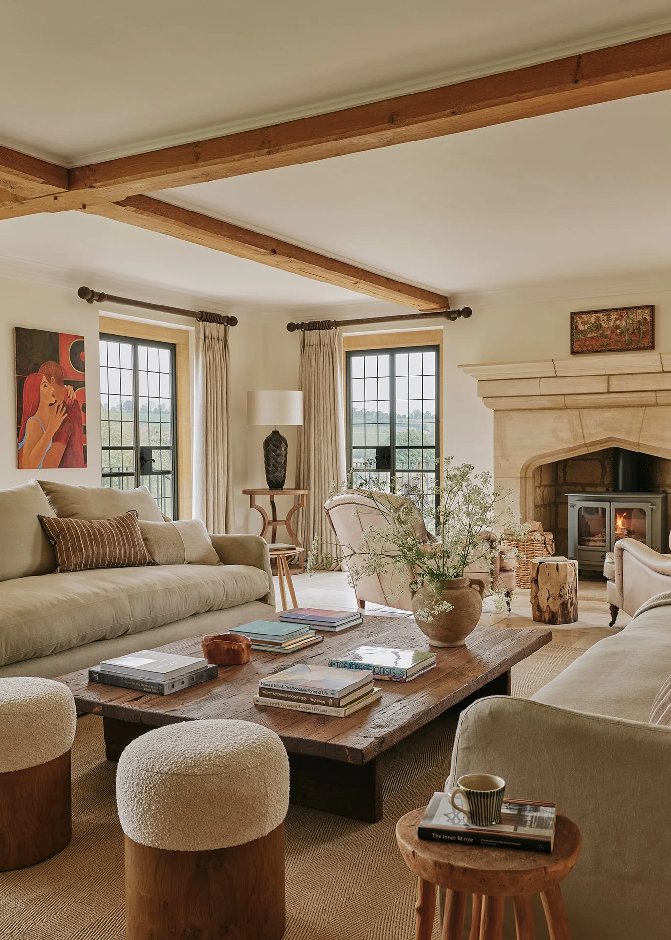 The living room is stylish and elegant, with a large woodburning stove, flagstone flooring, decadent rugs and two sumptuous sofas...
There’s also a baby grand piano - arrangements can be made for a local pianist to play for you.