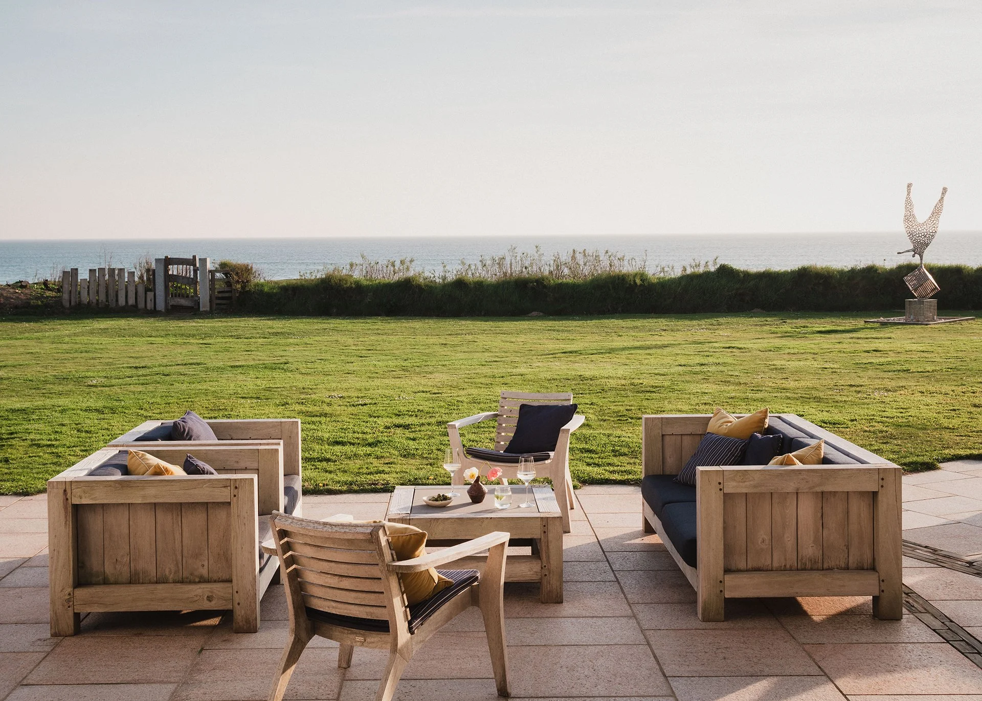 The acre of garden, featuring native plants and grasses, has a terrace with sun loungers, BBQ, Table Tennis table, firepit and extra seating.