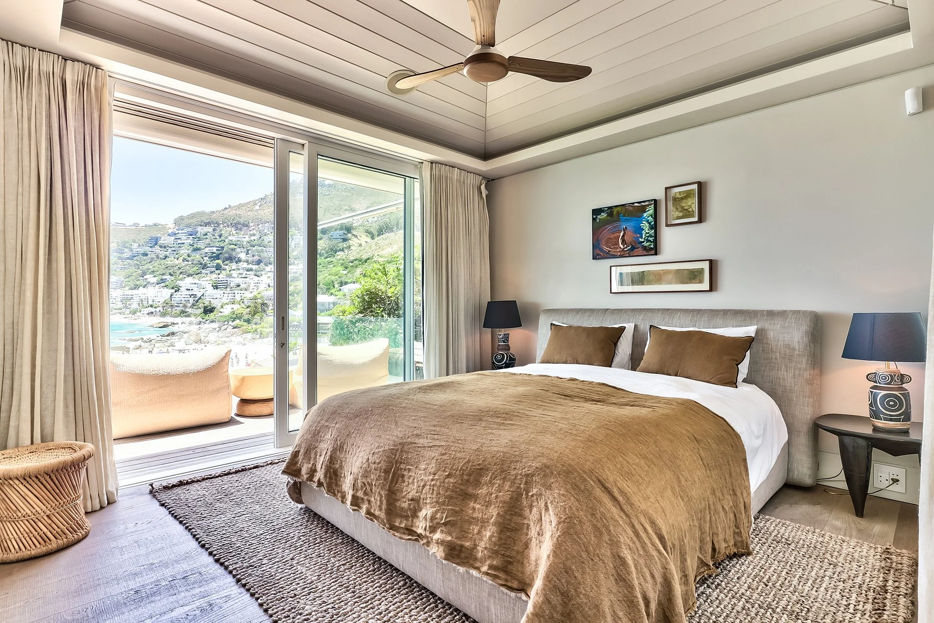 Each of the three bedrooms has an en suite bathroom, king-size bed and access to outside decked areas through floor-to-ceiling windows. The master bedroom has a spacious bathroom with two sinks, shower and contemporary freestanding oval bath.