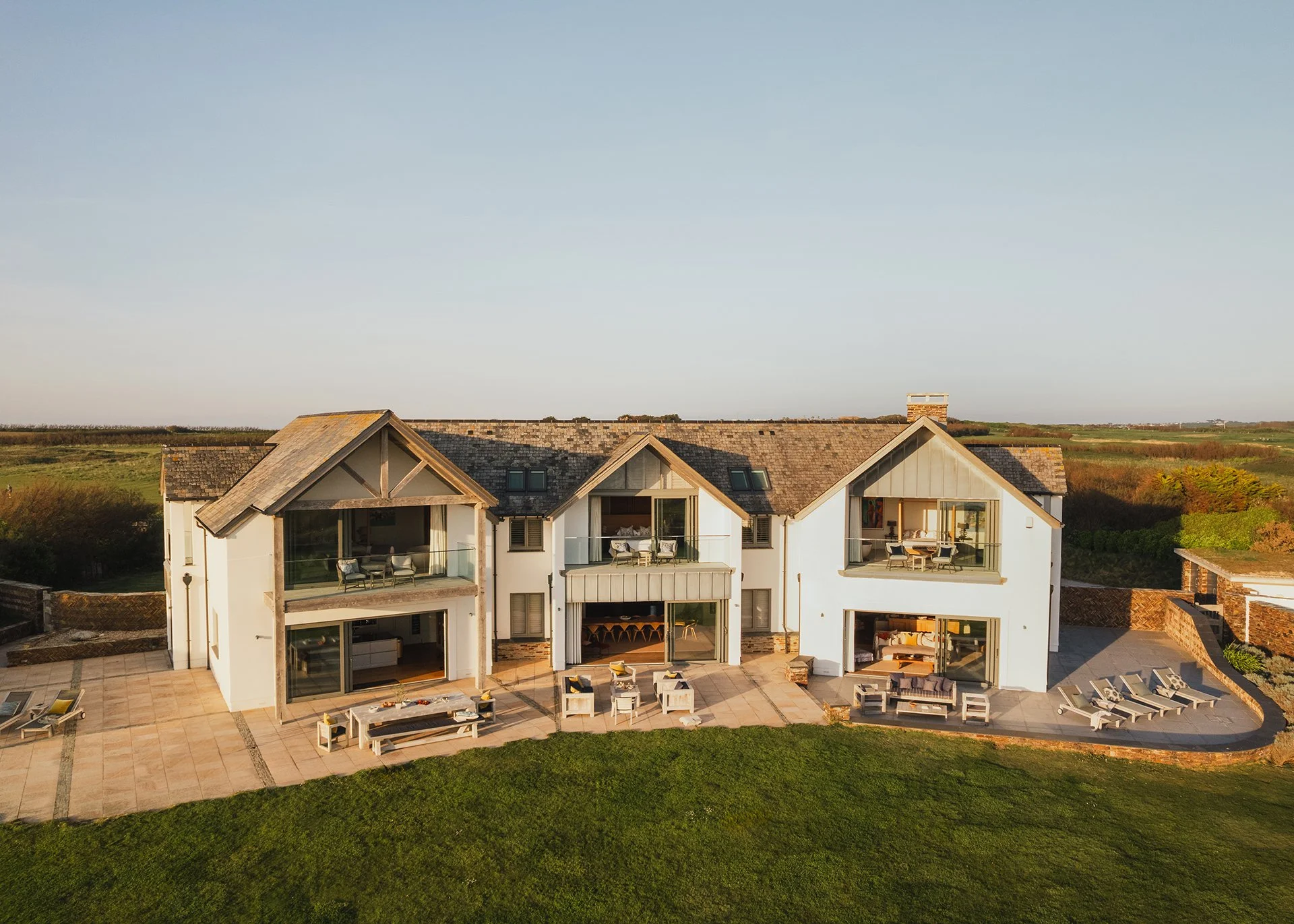 Swathed in glass and timbered gables, Little Polgarron is the ultimate Cornish beach house accommodating up to 10 guests and located next to the prestigious Trevose Head golf course and just a few minutes' walk from the beach at Booby's Bay. This is 