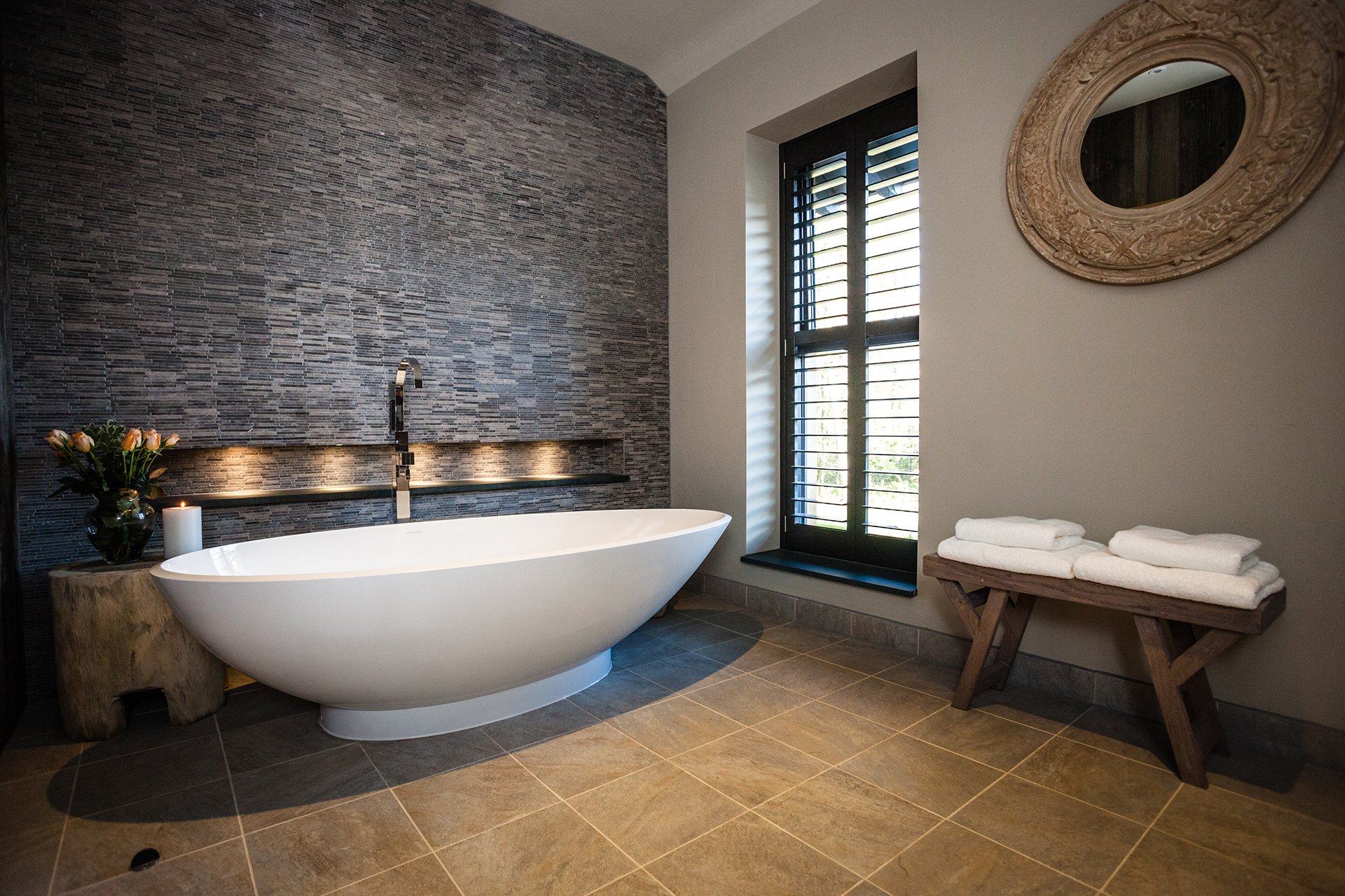 Two bedrooms have oval baths overlooking Lake Windermere. All bathrooms have Mandarin Stone walls and giant Drench showers.