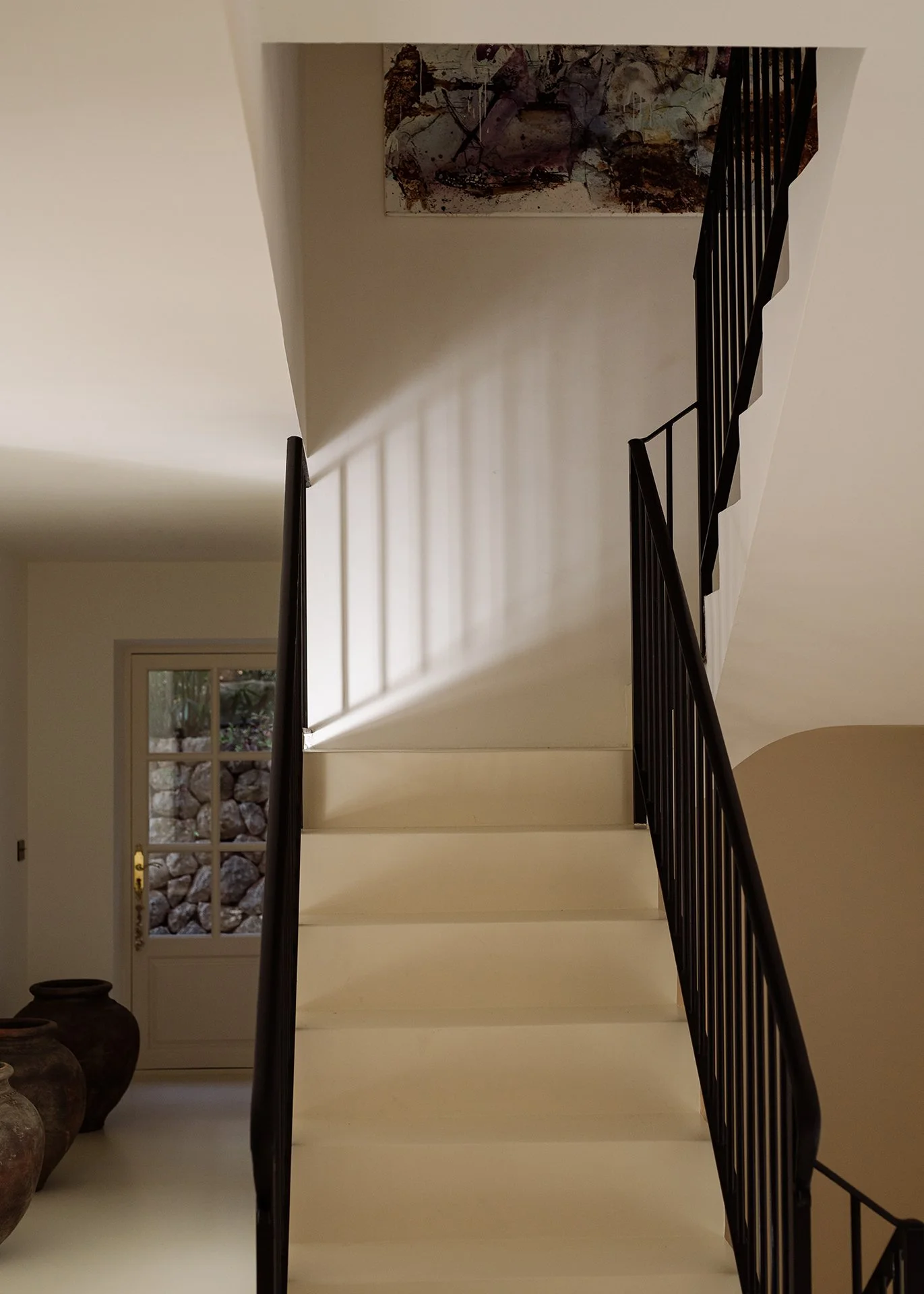 The house’s fresh sun-bleached walls with warm earthy hues and spacious open-plan areas are brimming with natural light, exquisite Spanish art and bespoke furniture.