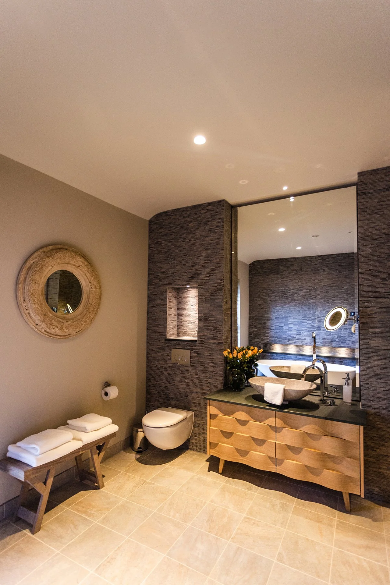 Two bedrooms have oval baths overlooking Lake Windermere. All bathrooms have Mandarin Stone walls and giant Drench showers. Escape to Grey Gables, Lake Windermere.