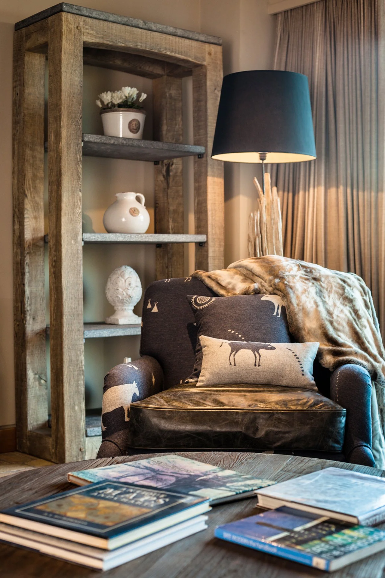 The lake house sleeps up to 10 guests in five bedrooms with interiors features such as decorative antlers, warm plaid fabrics and faux fur rugs contributing to its ski chalet/hunting lodge vibe. 