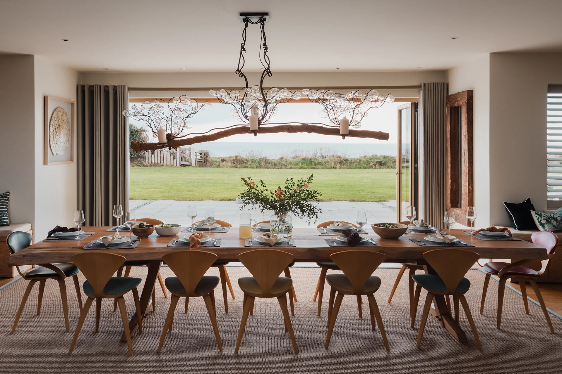 The adjacent dining features a bespoke dining table from New York with Cherner. Doors lead out to the garden terrace and garden - perfect for an evening BBQ.