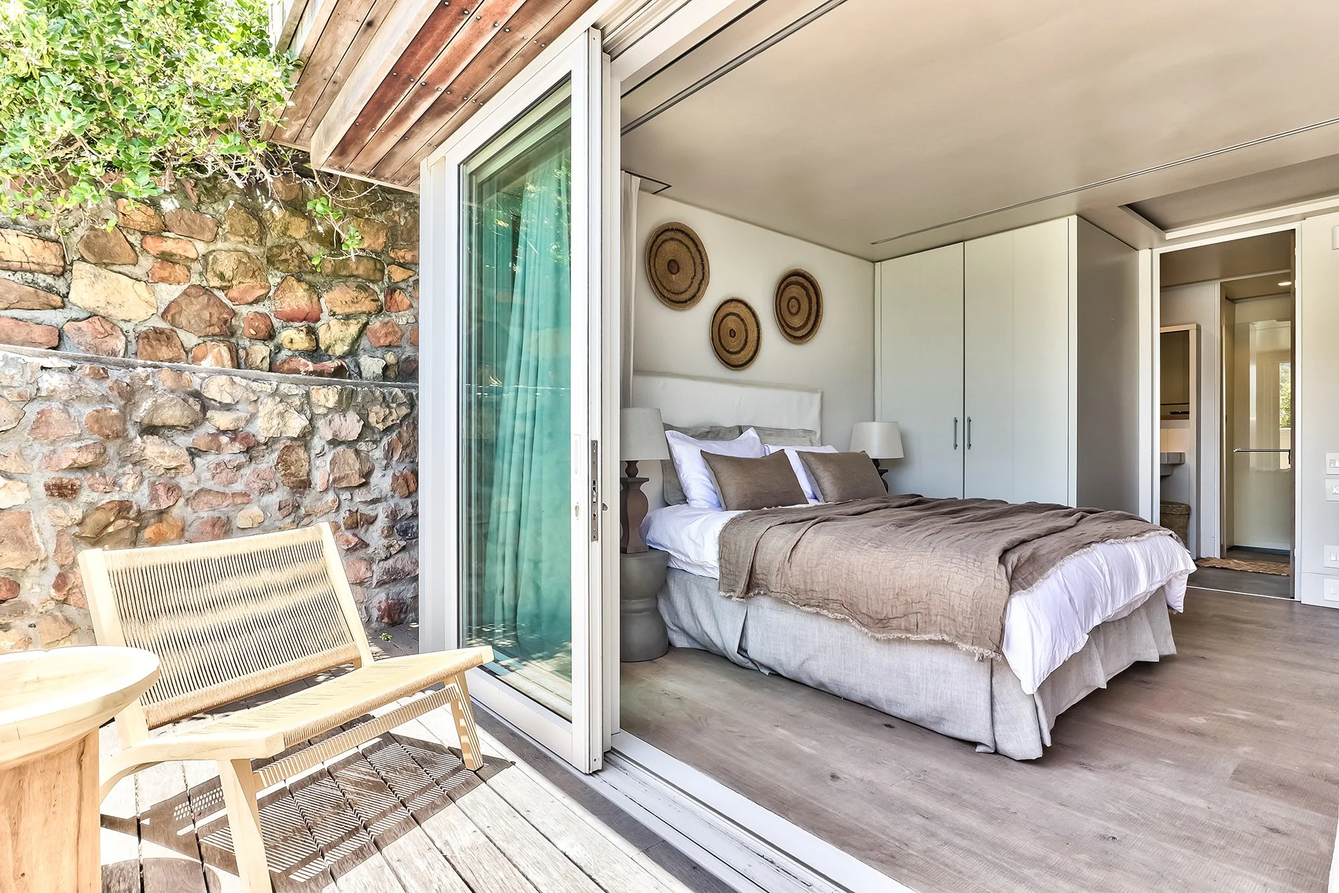 Each of the three bedrooms has an en suite bathroom, king-size bed and access to outside decked areas through floor-to-ceiling windows.