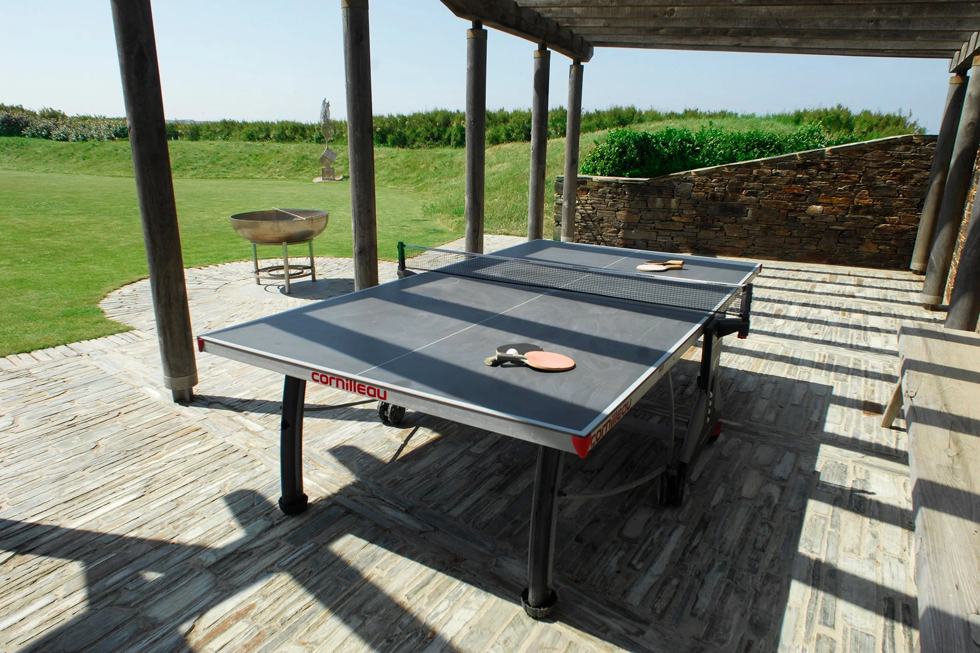 The acre of garden, featuring native plants and grasses, has a terrace with sun loungers, BBQ, Table Tennis table, firepit and extra seating.