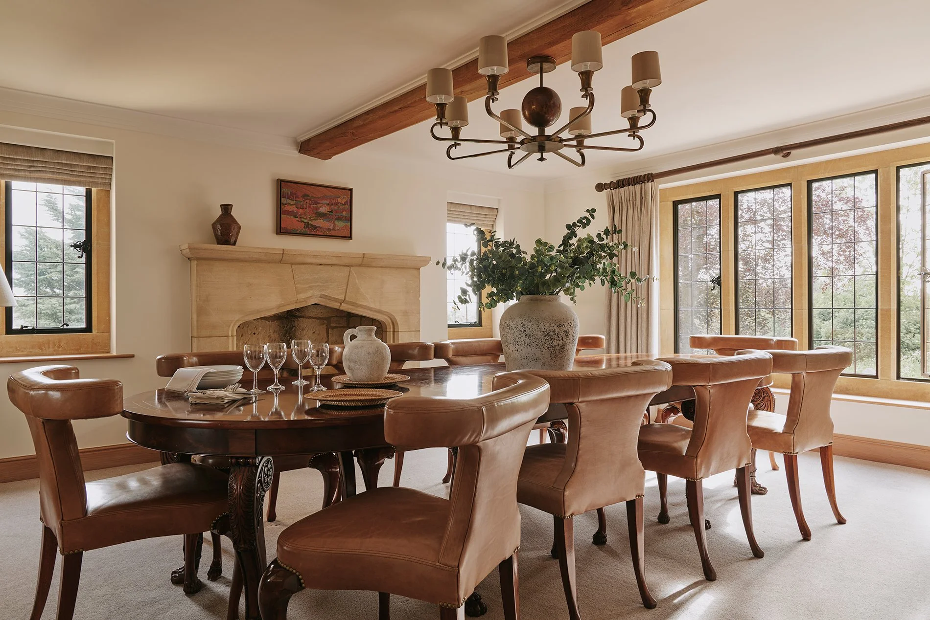 For more formal dining, the dining room’s beautiful oval table also seats ten. A Tondo mirror in oxidised silver, a nickel chandelier and a luxurious carpet, lamps and chairs complete the indulgent look. Book your stay at Elkstones, Cotswolds. 