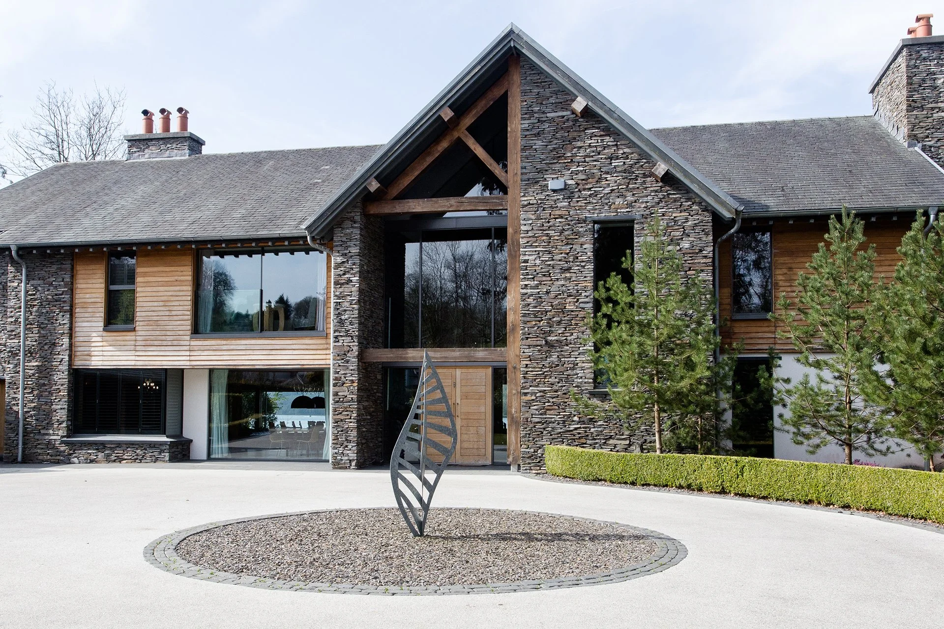 The lake house sleeps up to 10 guests in five bedrooms with interiors features such as decorative antlers, warm plaid fabrics and faux fur rugs contributing to its ski chalet/hunting lodge vibe.