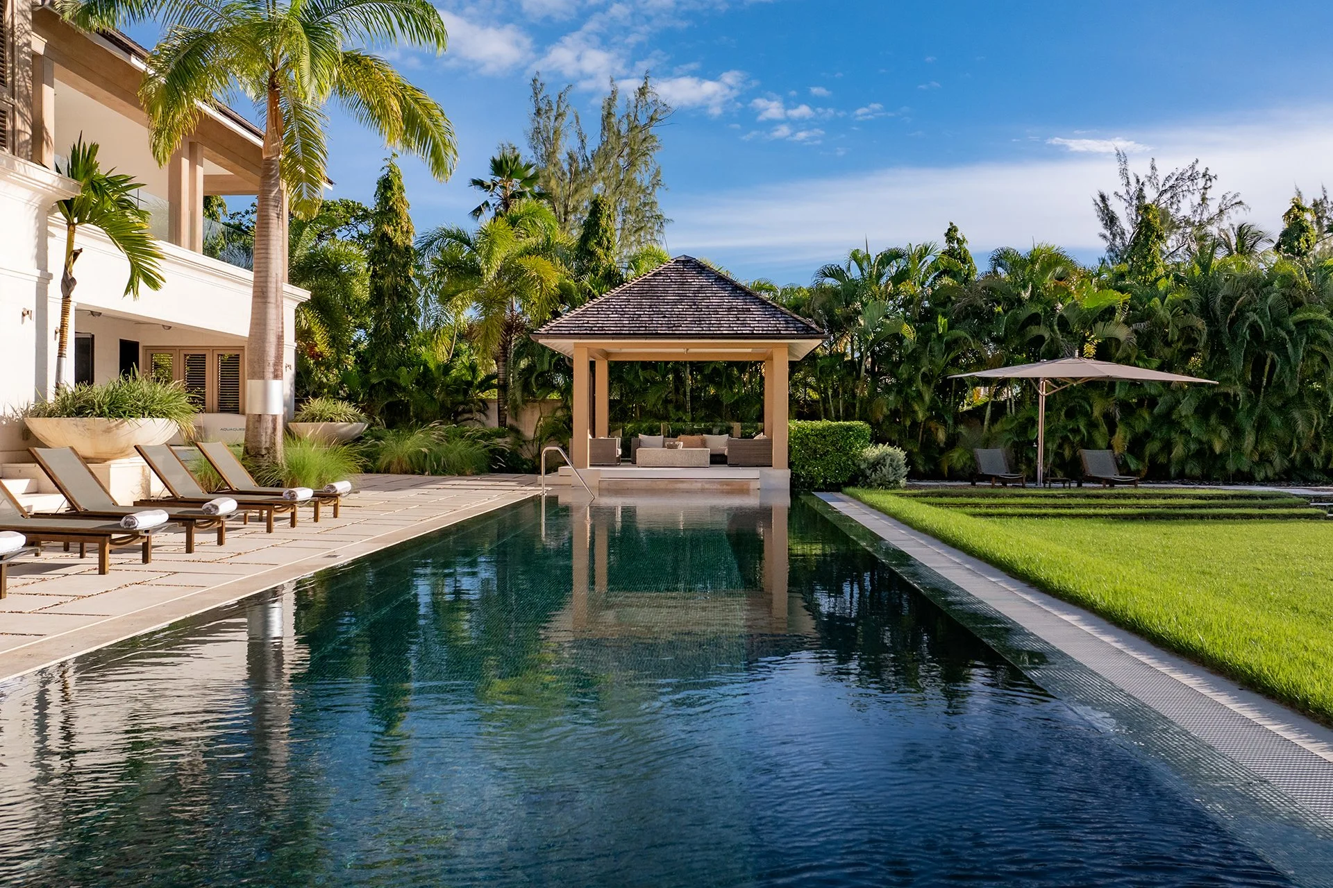 The sleek 25m mosaic-lined pool surrounded by limestone tiles and comfy sun loungers. Around 1.2 acres of landscaped gardens with palm trees, scented shrubs and a spice garden.