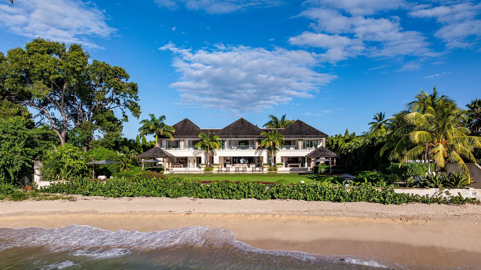 Measuring over 1,250 metres square, the villa was designed by local award-winning architects Gillespie & Steel and uses some of the island’s most beautiful materials. The clever design brings the outside in with incredible views of the infinity pool.