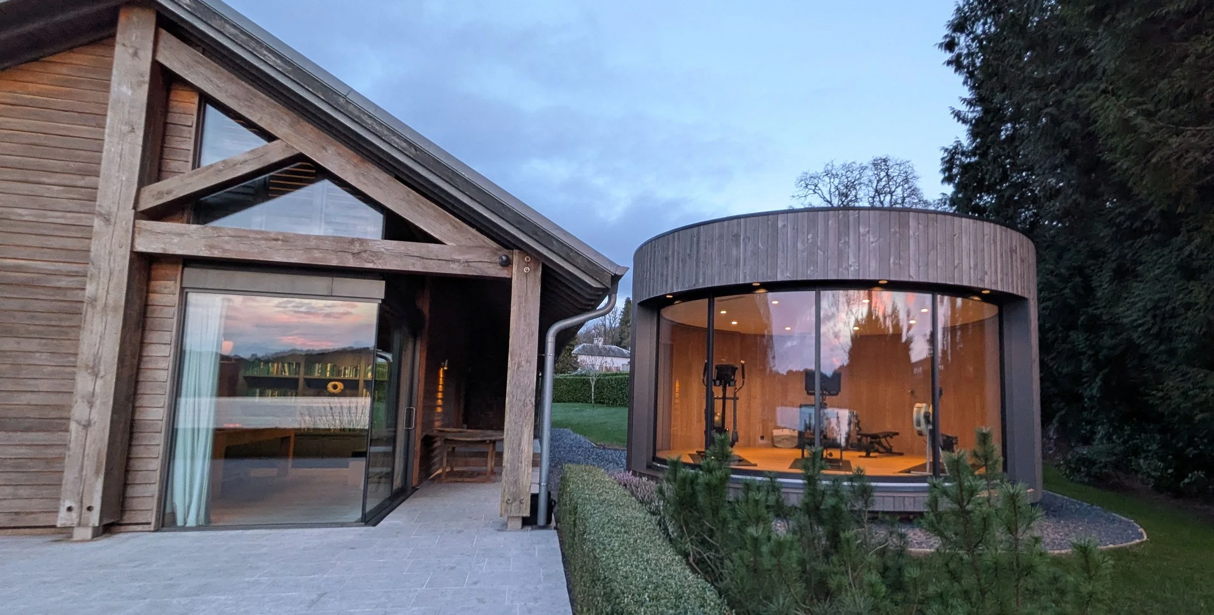 A private lumipod gym, equipped with Peloton bike, cross trainer, rower and free weights with Lake views, provides a serene space for fitness and wellness. Enquire now for guest-favourite, lakeside holiday home, Grey Gables. 