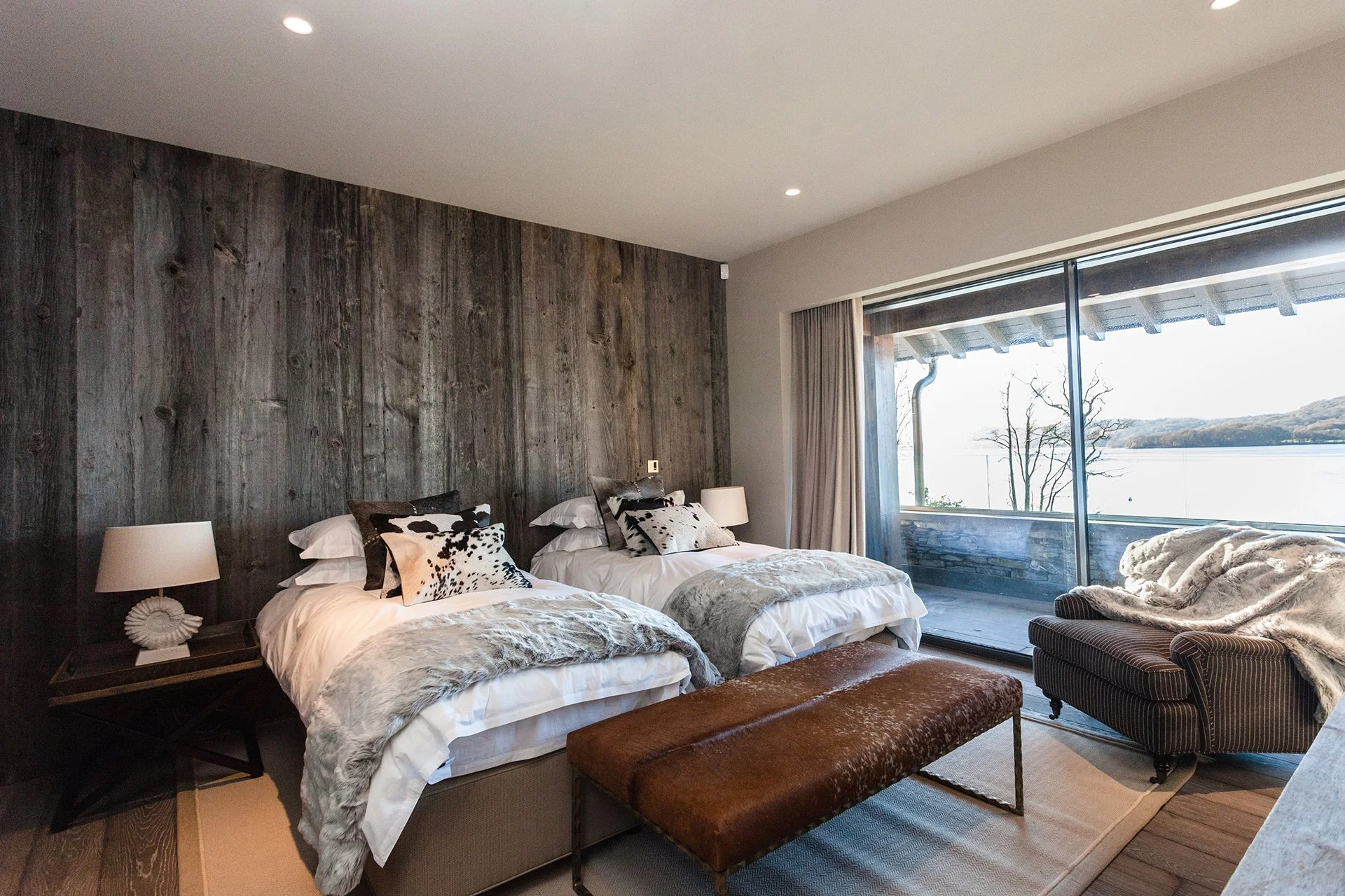 There are five en-suite bedrooms with floor-to-ceiling windows, four of which have uninterrupted lake views. Three have balconies. Each has a ViSpring bed, two of which can be made up as twins. Escape to Grey Gables for a wellness reset. 