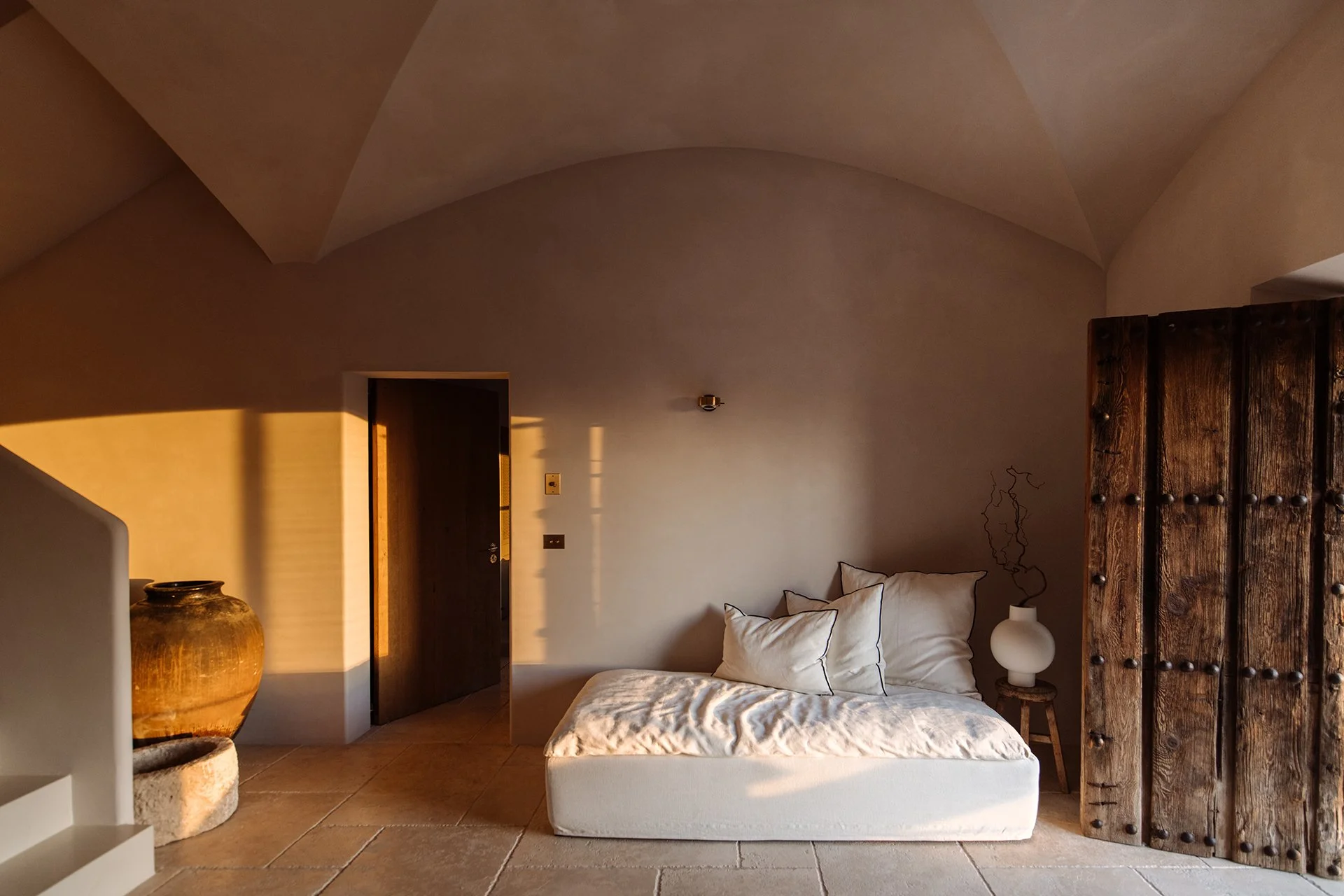 Sunlight floods the open-plan living areas, highlighting pieces by renowned designers, along with state-of-the-art appliances to make each stay as comfortable as possible.