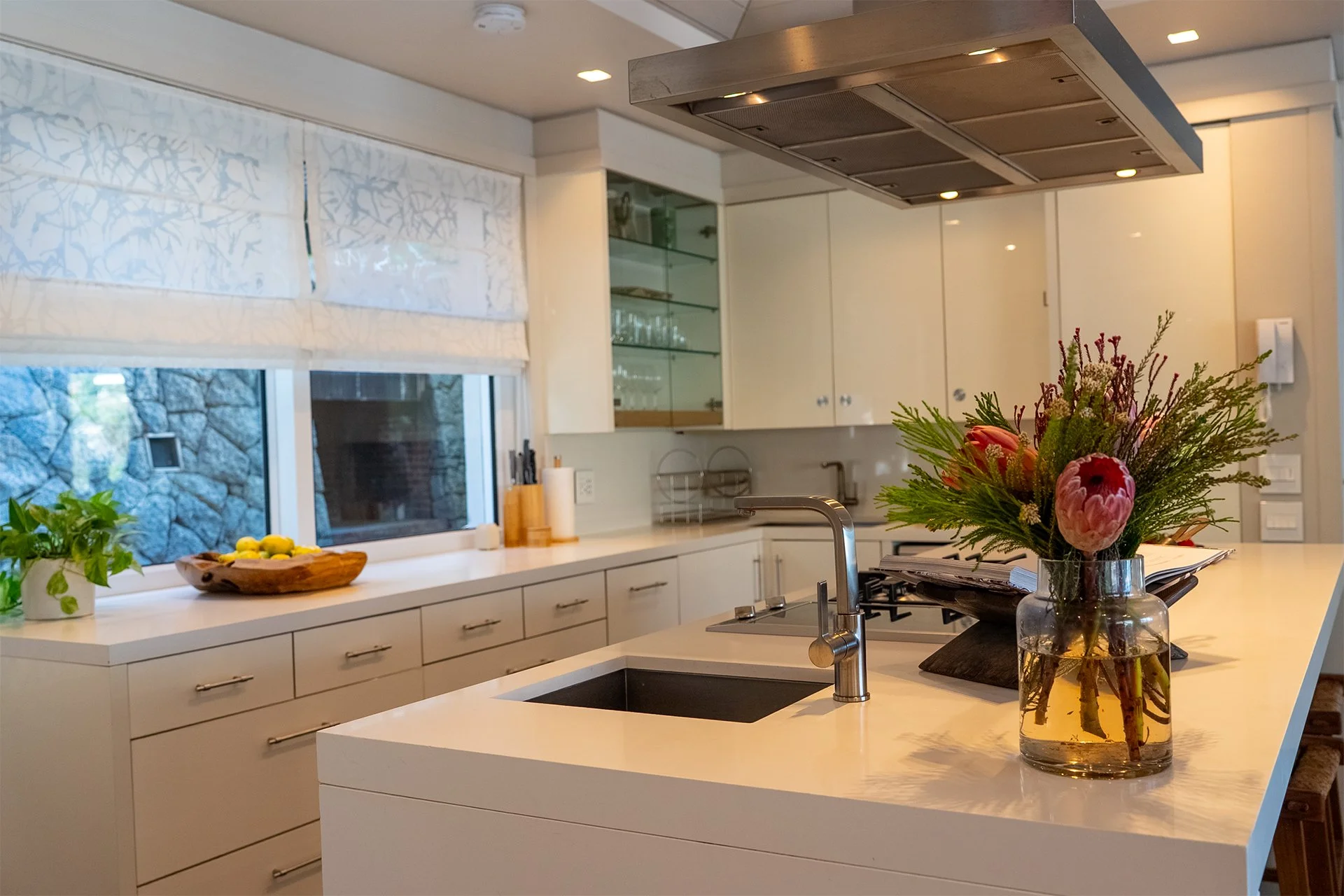The kitchen is fully-equipped with island and cooker/worktop offering ocean views.