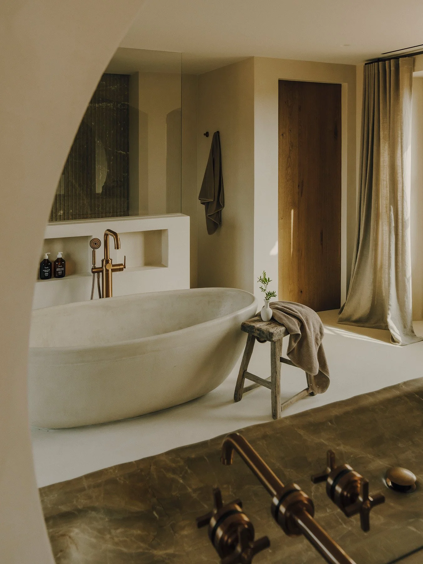 The Master bedroom, located on the first floor, has both a free-standing bath and separate shower. Its own private terrace with bench seating and far-reaching countryside mountain views.
