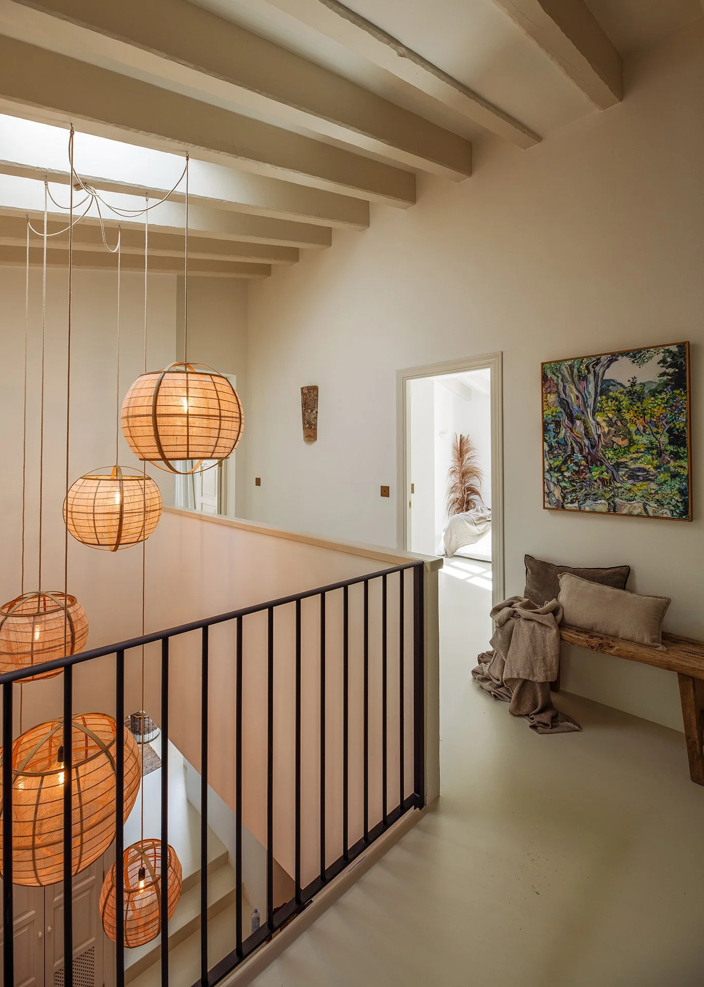 The house’s fresh sun-bleached walls with warm earthy hues and spacious open-plan areas are brimming with natural light, exquisite Spanish art and bespoke furniture.
