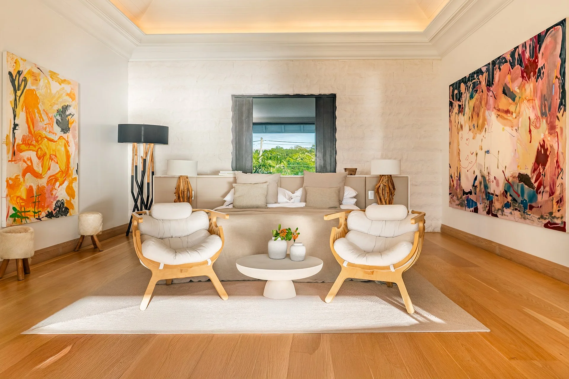 A double staircase with feature Verpan seashell chandelier leads upstairs to five spacious en suite bedrooms, some with four-poster beds; all with American oak flooring, Ralph Lauren bed stools and other unique design pieces.